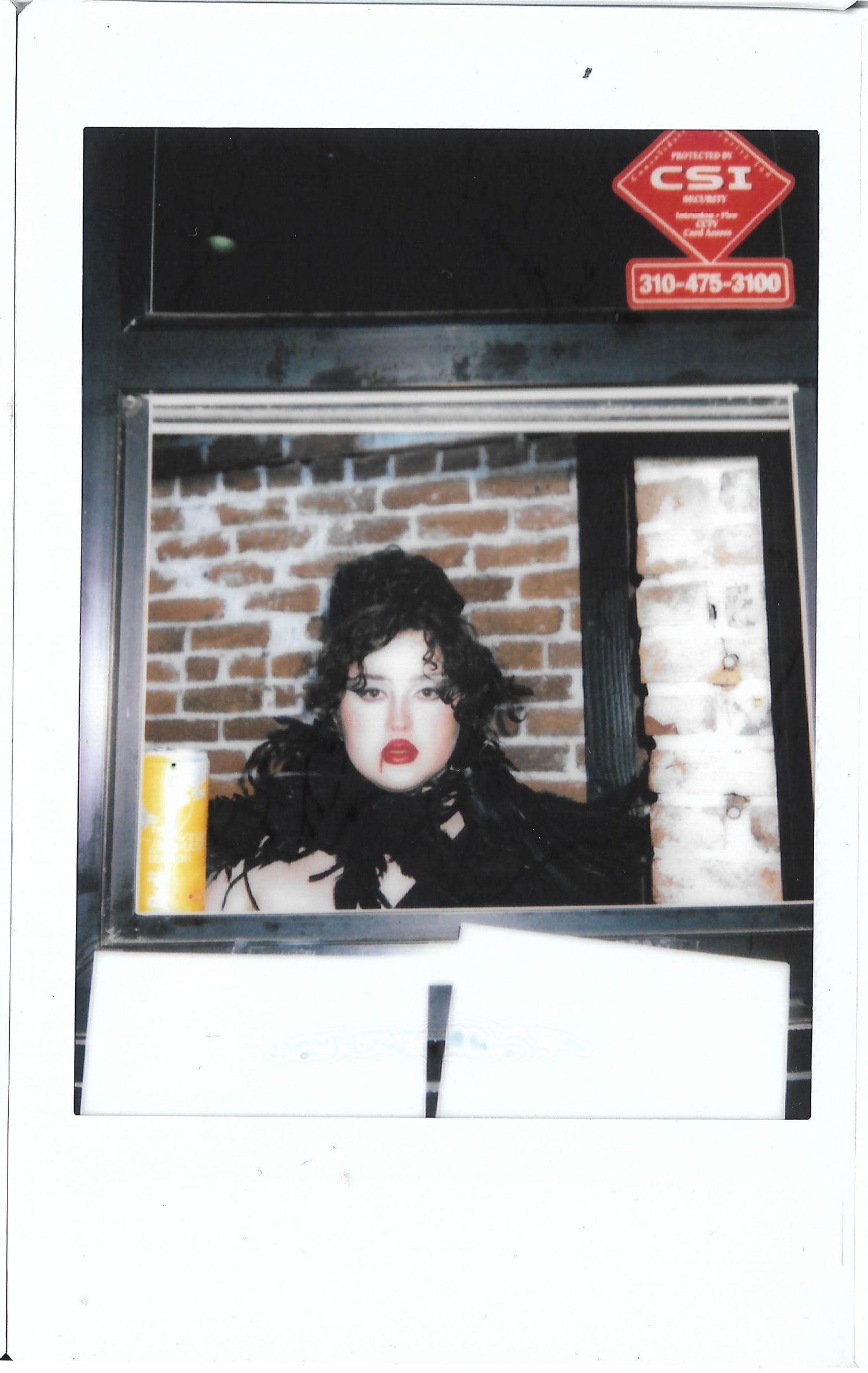 Photograph of drag queen operating the ticket booth at Beaches Tropicana West Hollywood. Photo by YUQ Studios