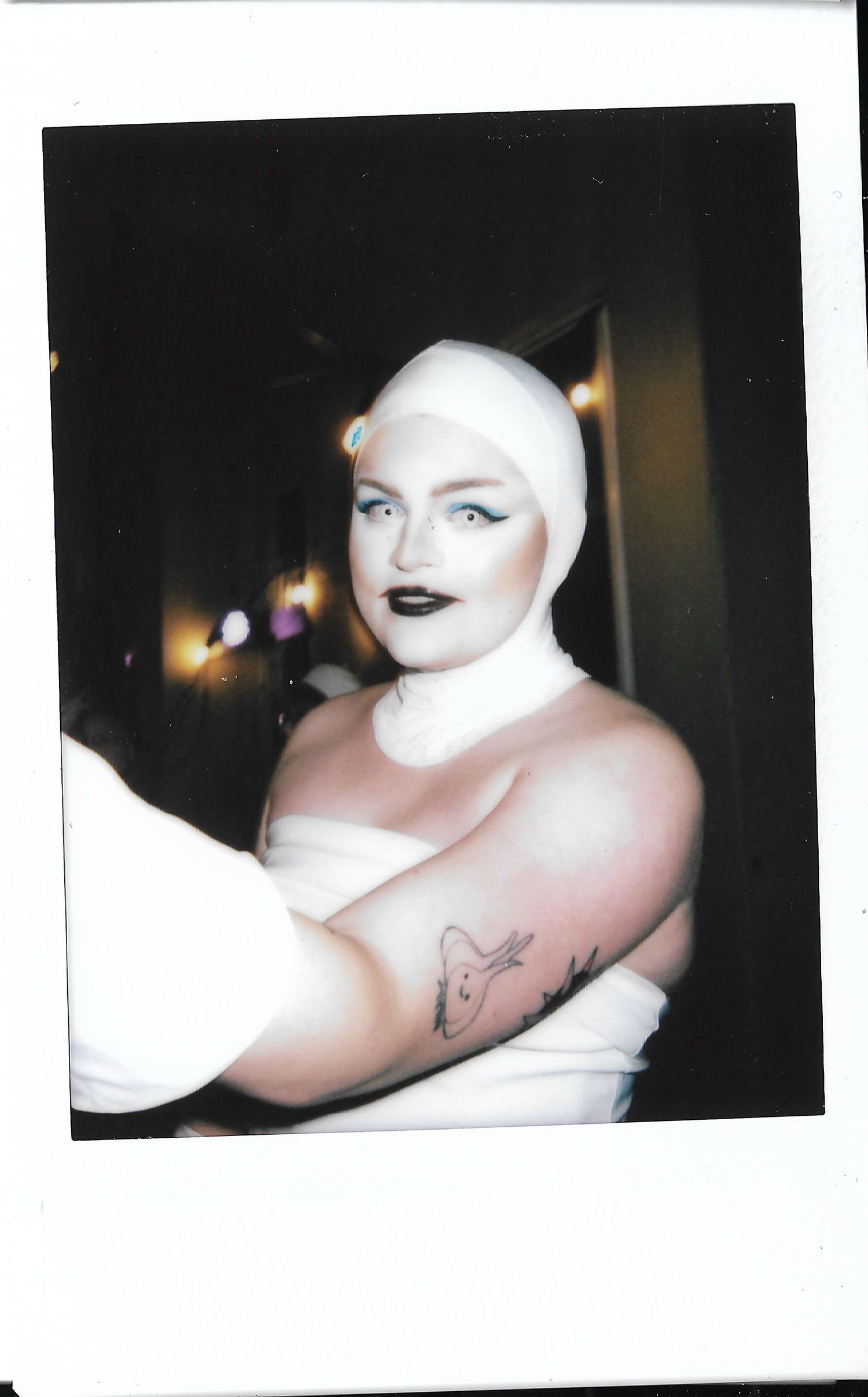 Photograph of drag artist cosplaying as Eve from Wall-E. Photo by Los Angeles photo/film production company, YUQ Studios.