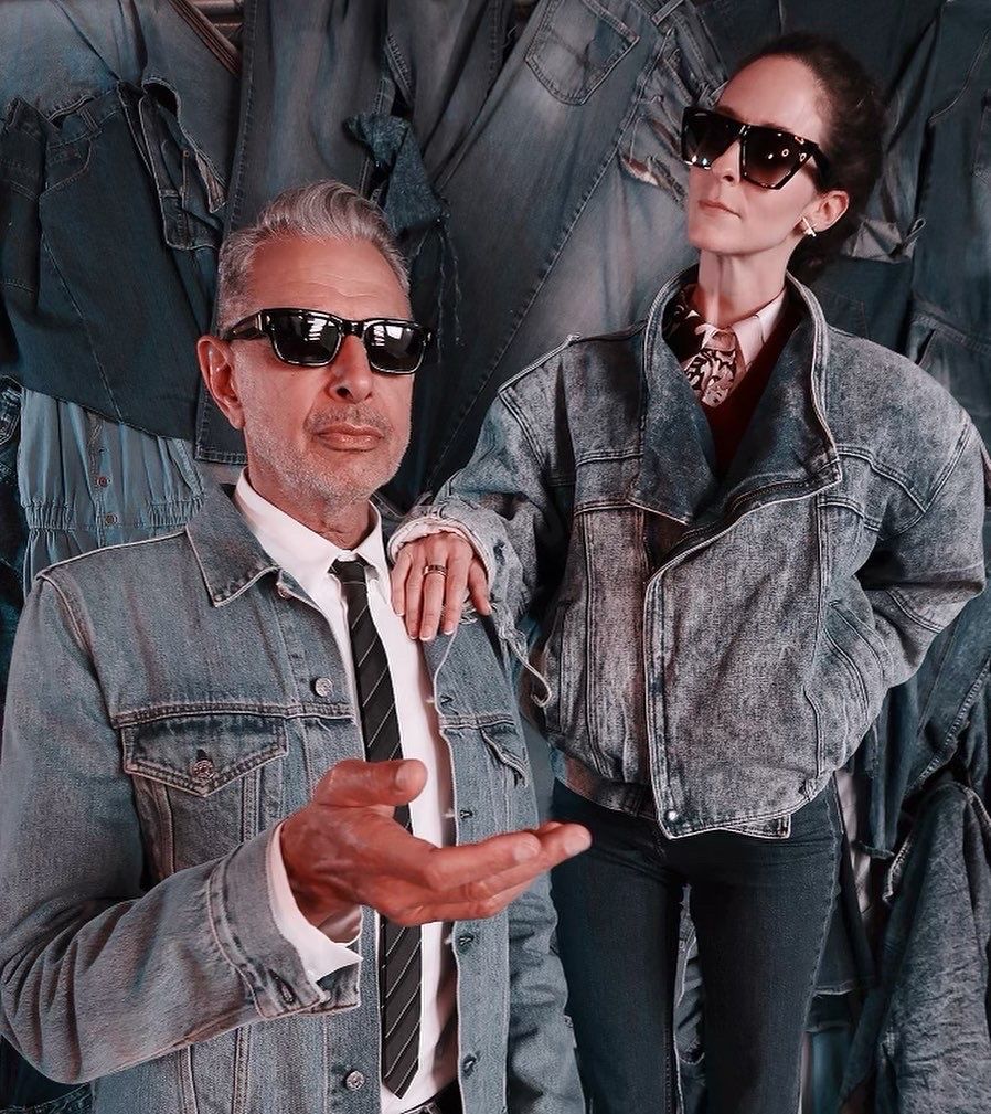 Jeff Goldblum is photographed on YUQ Studios DTLA iconic denim wall. Our denim wall is reservable at our DTLA photo studio rental.