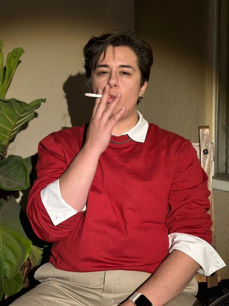 Photograph of young man smoking a cigarette. Photo by Los Angeles photo/film production company, YUQ Studios.