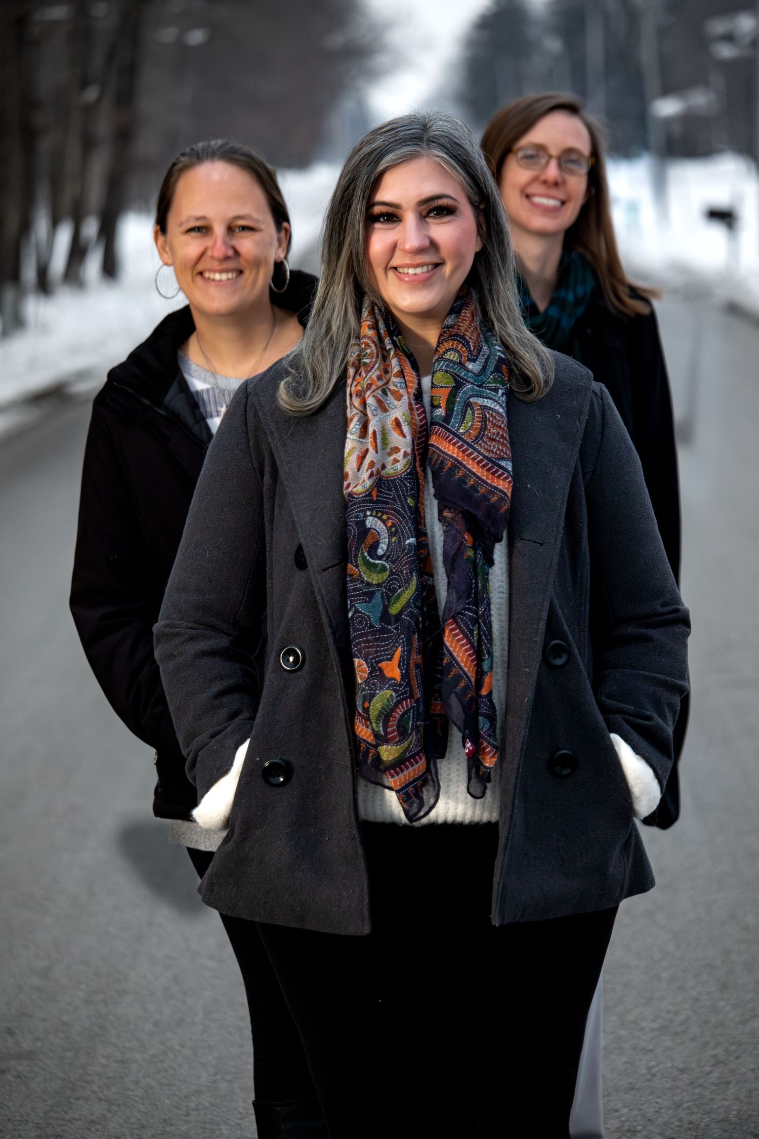 Three business professionals photographed for an organizational brand story