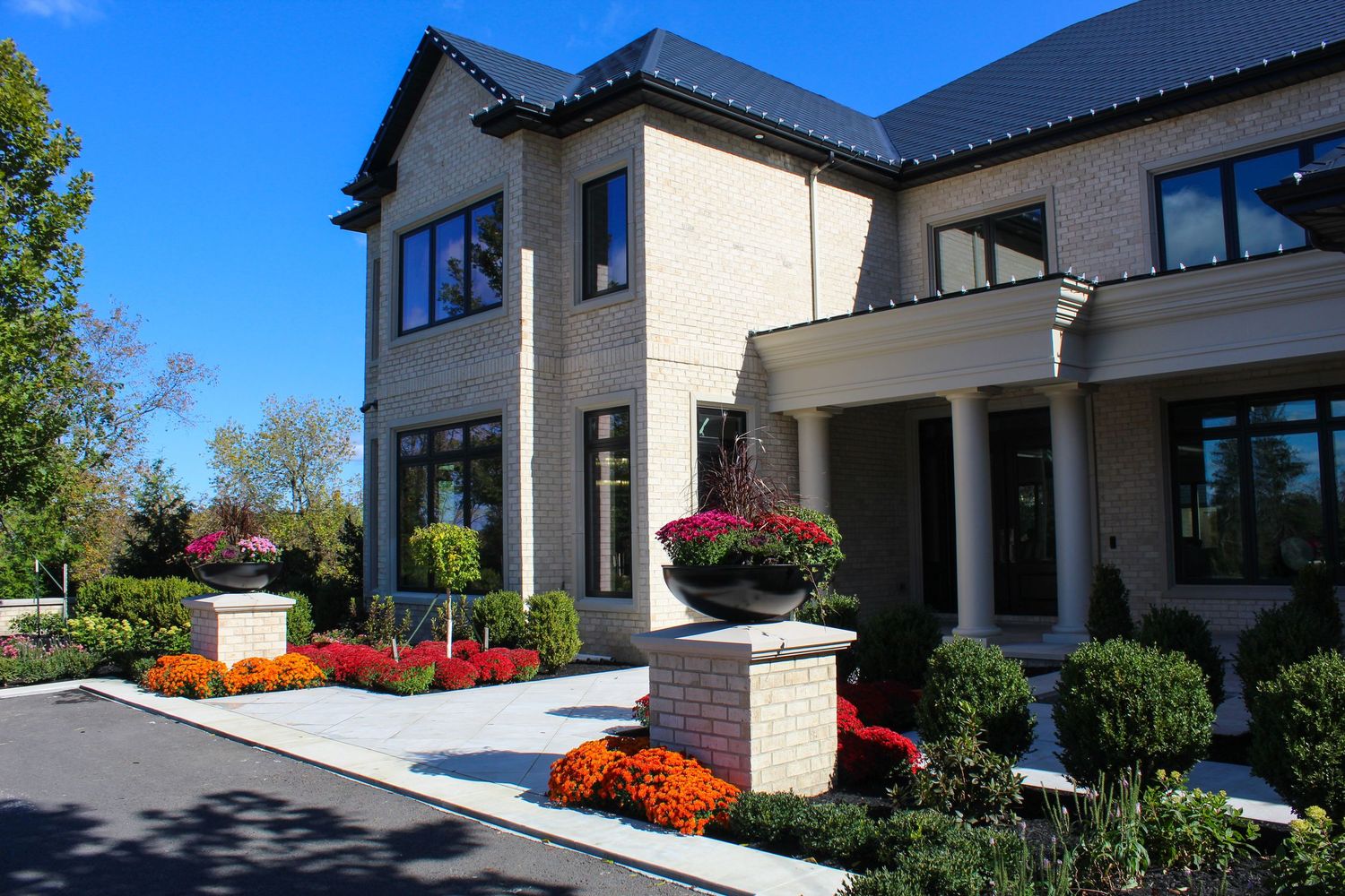 Landscaped luxury property exterior photographed in bright daylight