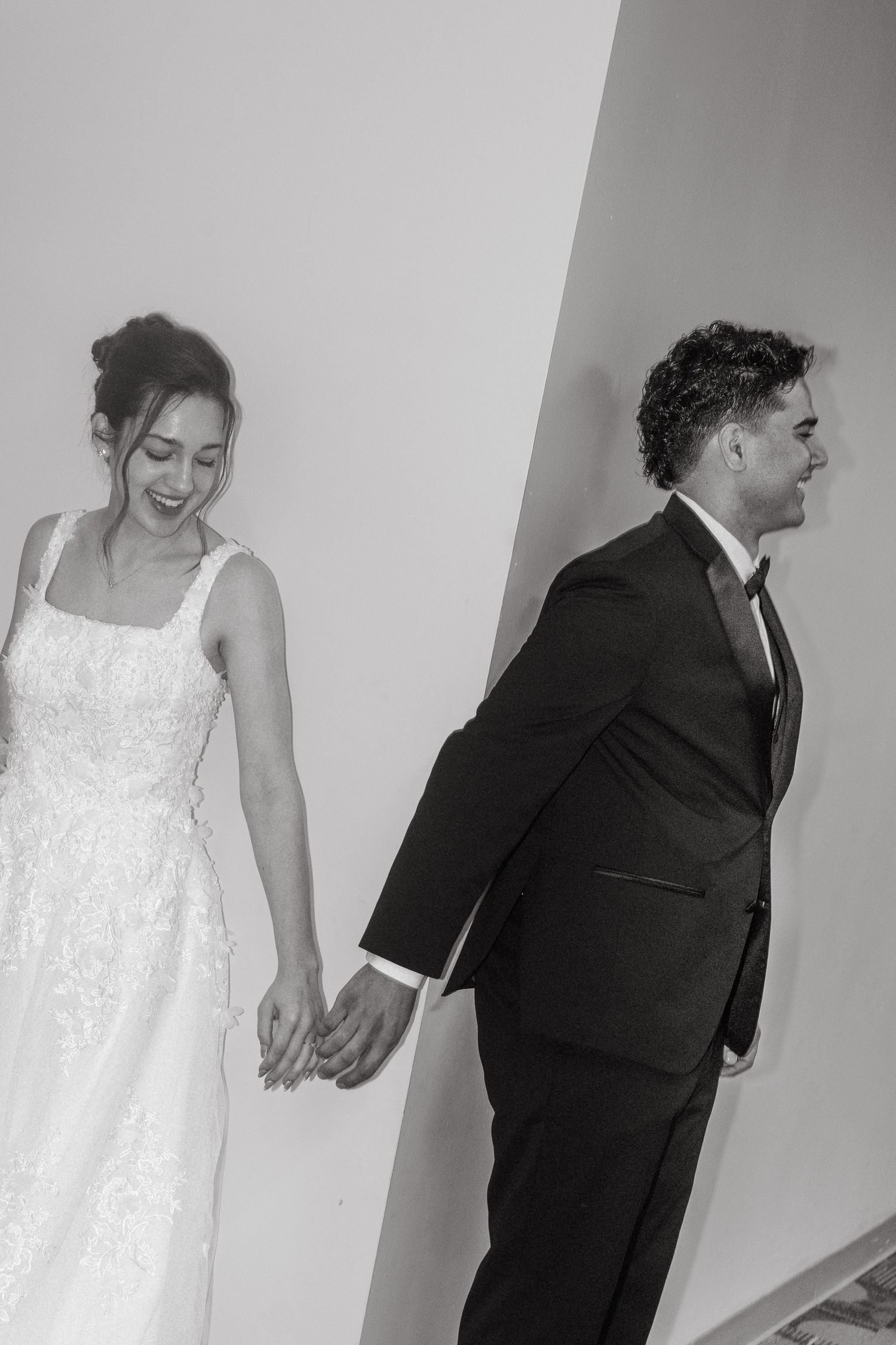Intimate first touch first prayer moment between bride and groom before their wedding ceremony in Tampa Florida