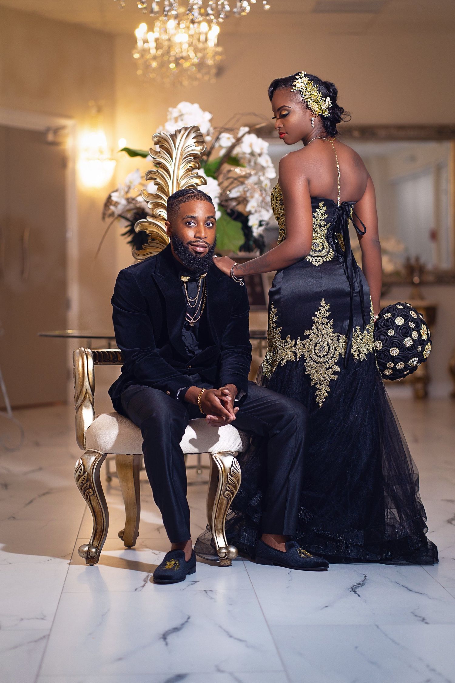 Formal event photography with elegant navy and gold formal wear in luxurious setting.