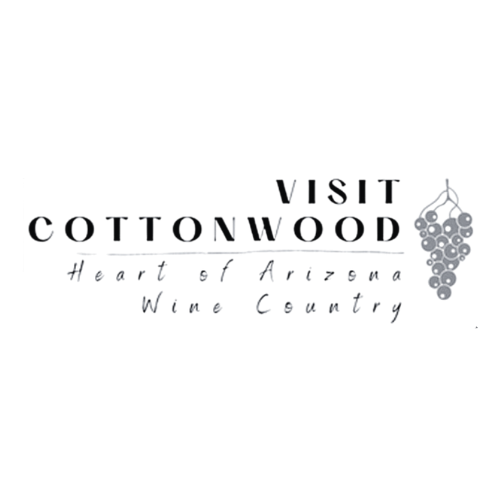 Decorative wine country logo with grape vine illustrations and elegant typography.