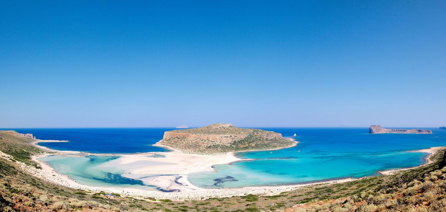 Stunning aerial view of Balos beach lagoon with turquoise waters and white sand in Crete, Greece.