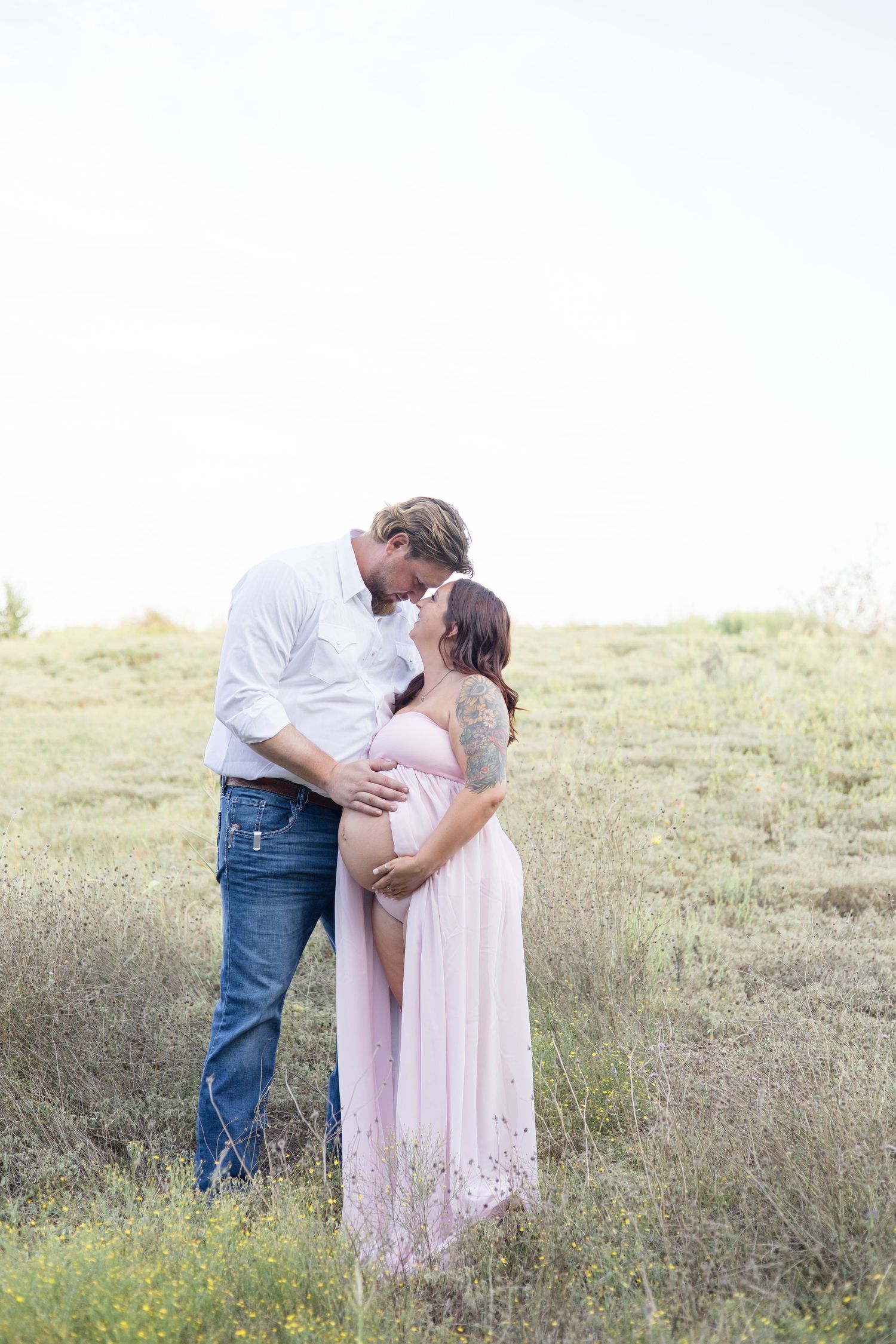 Couple poses during family session at Arbor Hills Nature Preserve for maternity session with McKinney Photographer Reagan Marie Photography