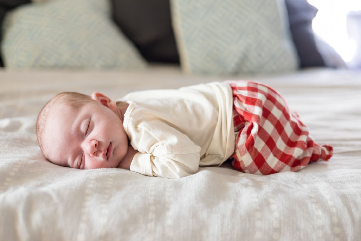 Detailed shot of newborn baby during in home lifestyle newborn session with McKinney newborn photographer Reagan Marie Photography