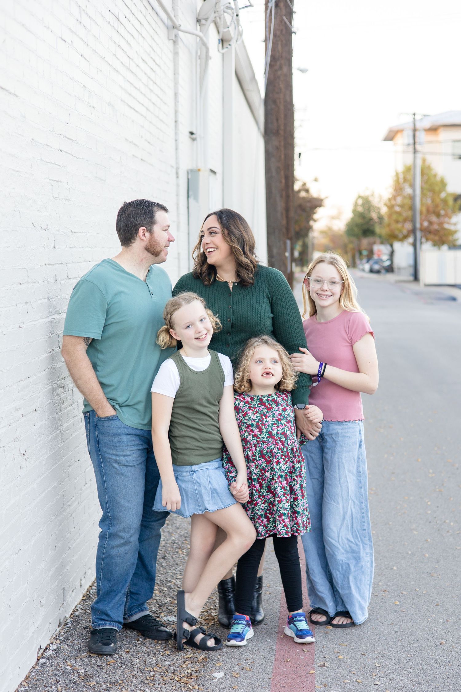 Family of 5 poses during fall mini session in Downtown McKinney, Texas with mini session and family photographer Reagan Marie Photography