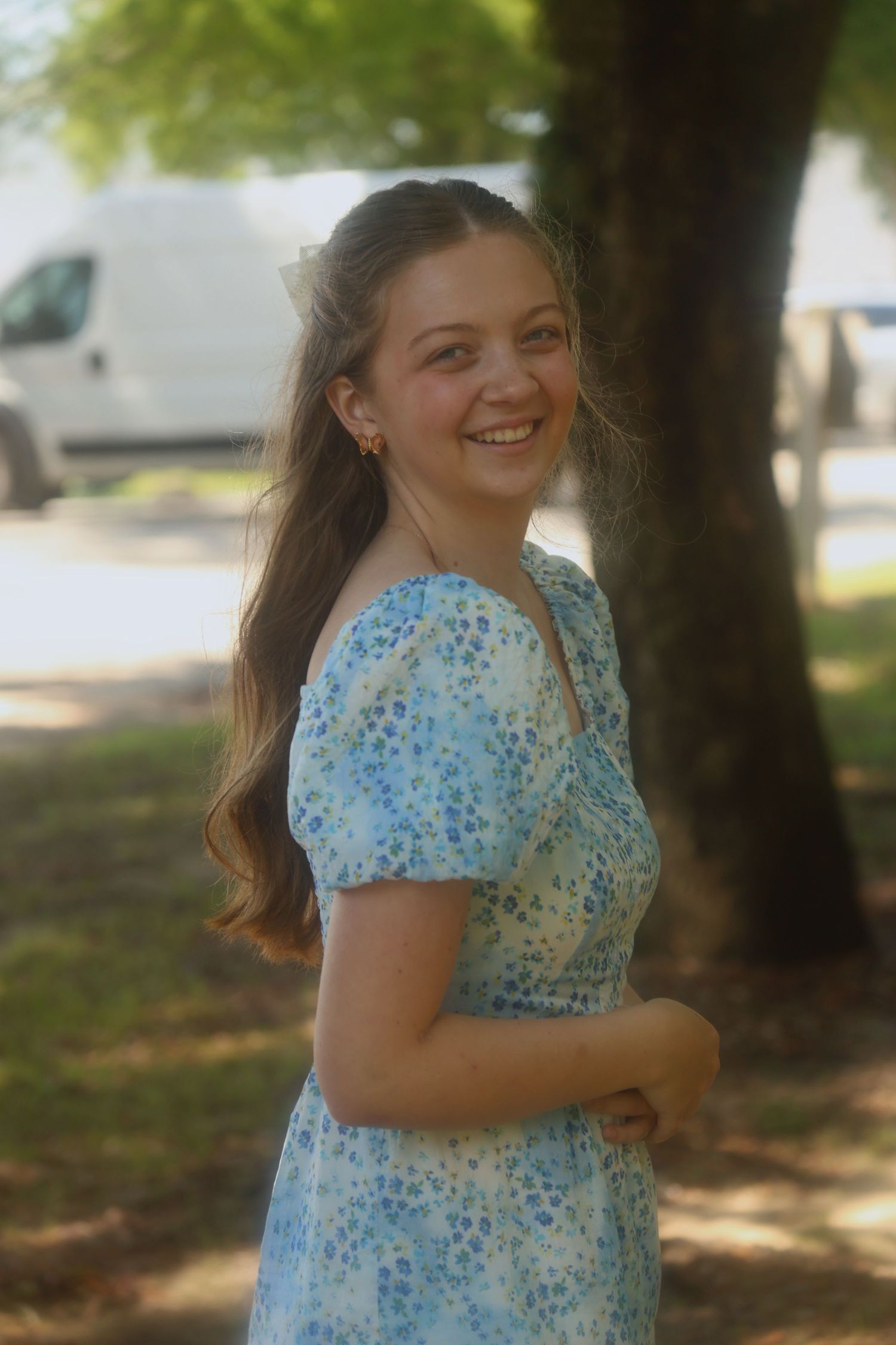 A vibrant portrait of a girl in a blue dress