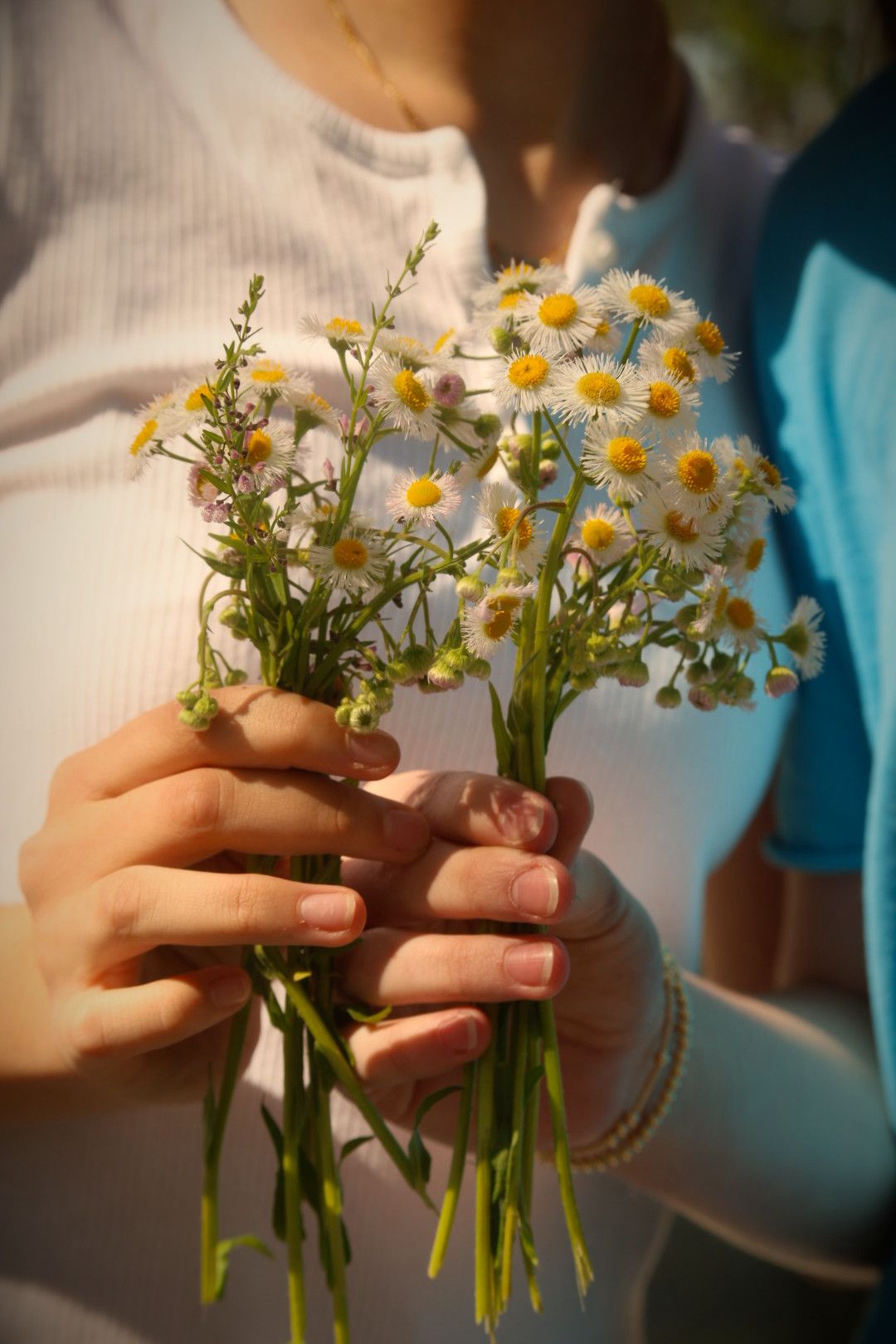 Girls holding a bouquet of flowers