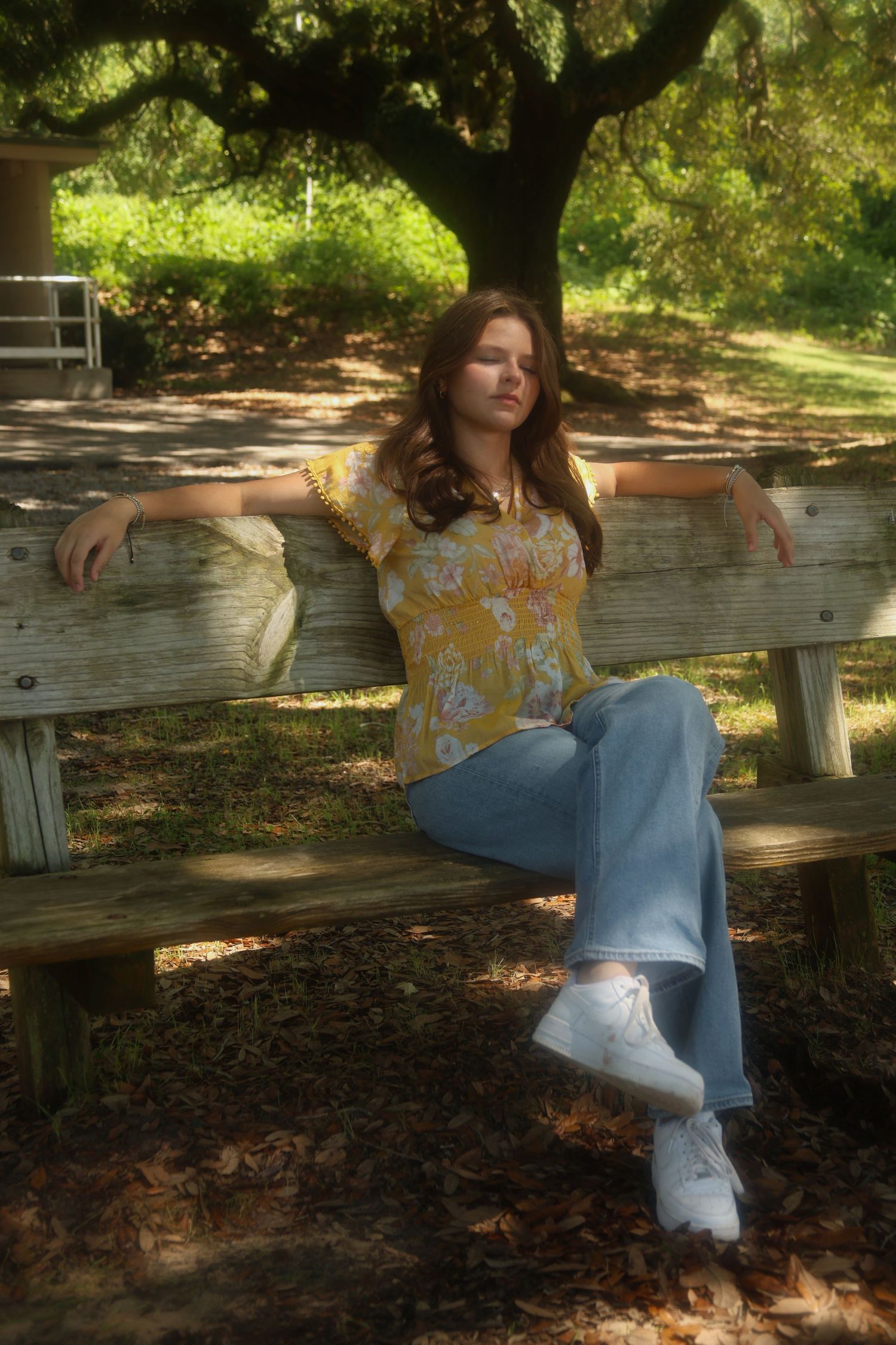 A girl sitting on a bench