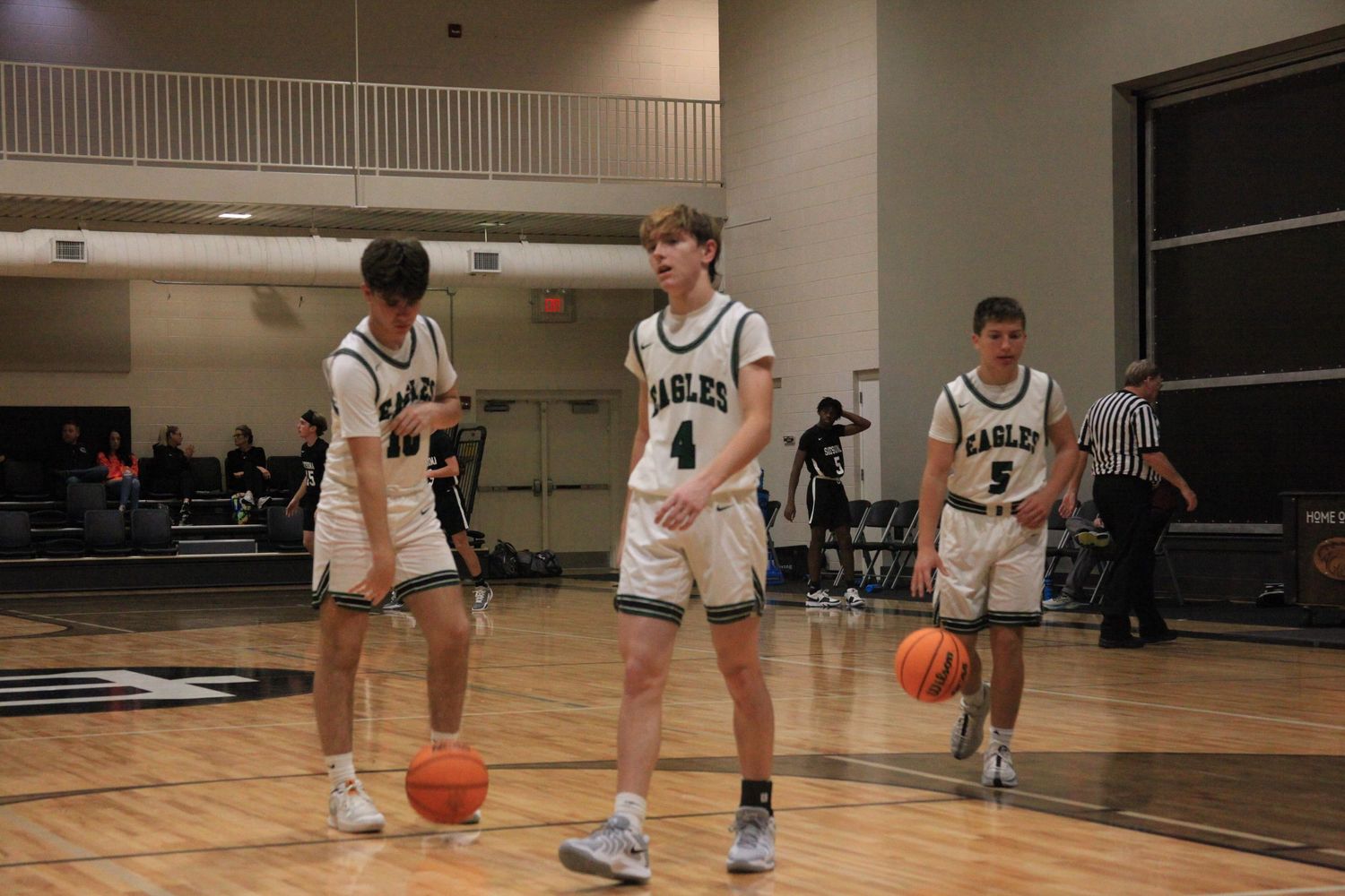Three basketball players