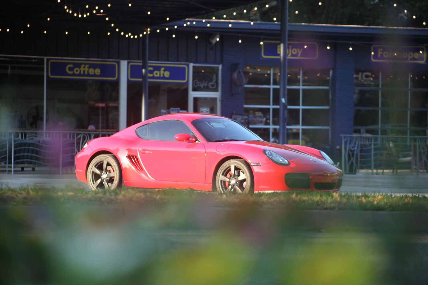 Red Porsche 987 framed with flowers