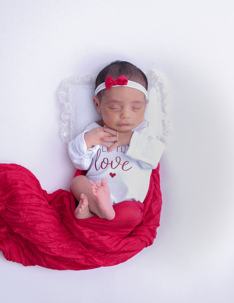 Newborn baby sleeping peacefully on red fabric in three similar poses against white background.