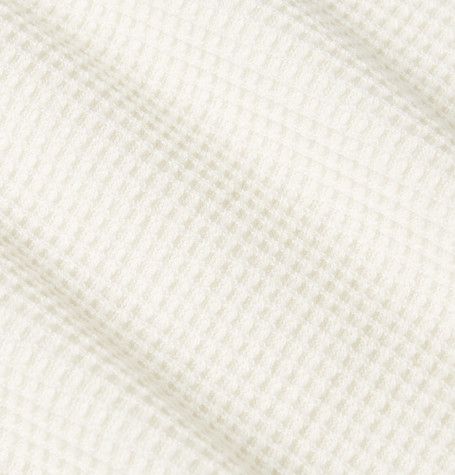 close up of cream waffle knit fabric