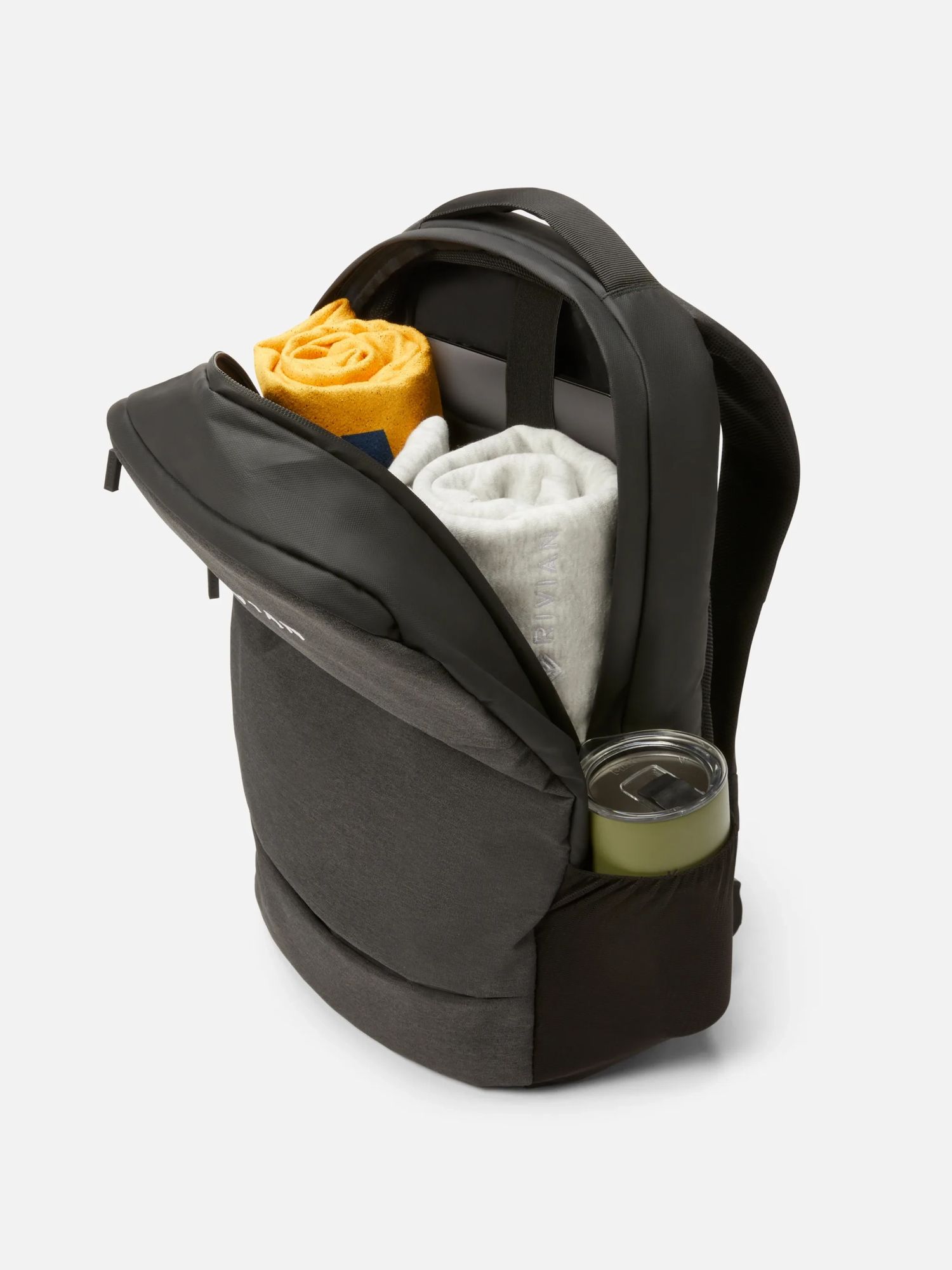 Backpack filled with towel and thermos