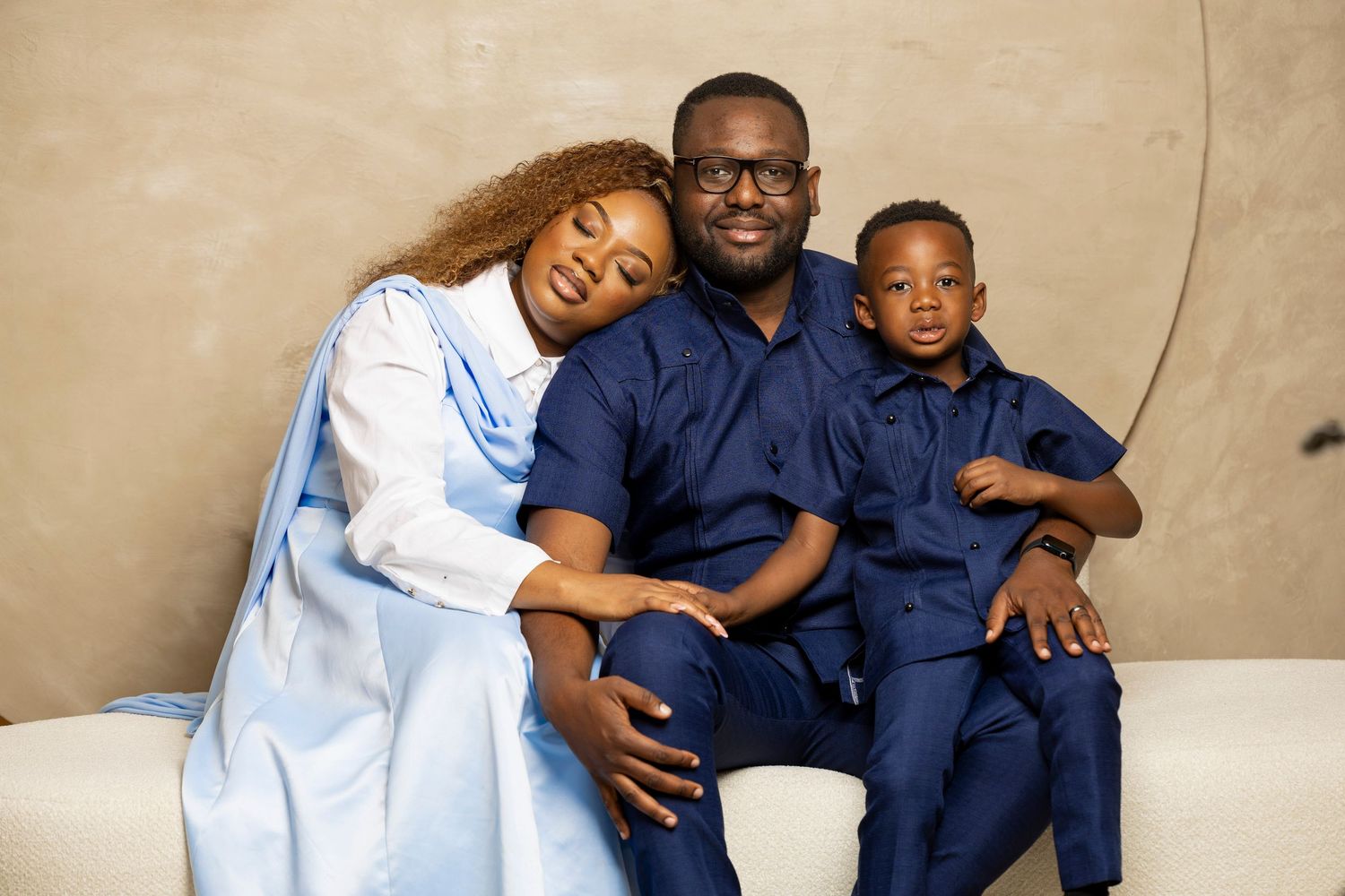 Family wearing coordinated outfits professional photos.
