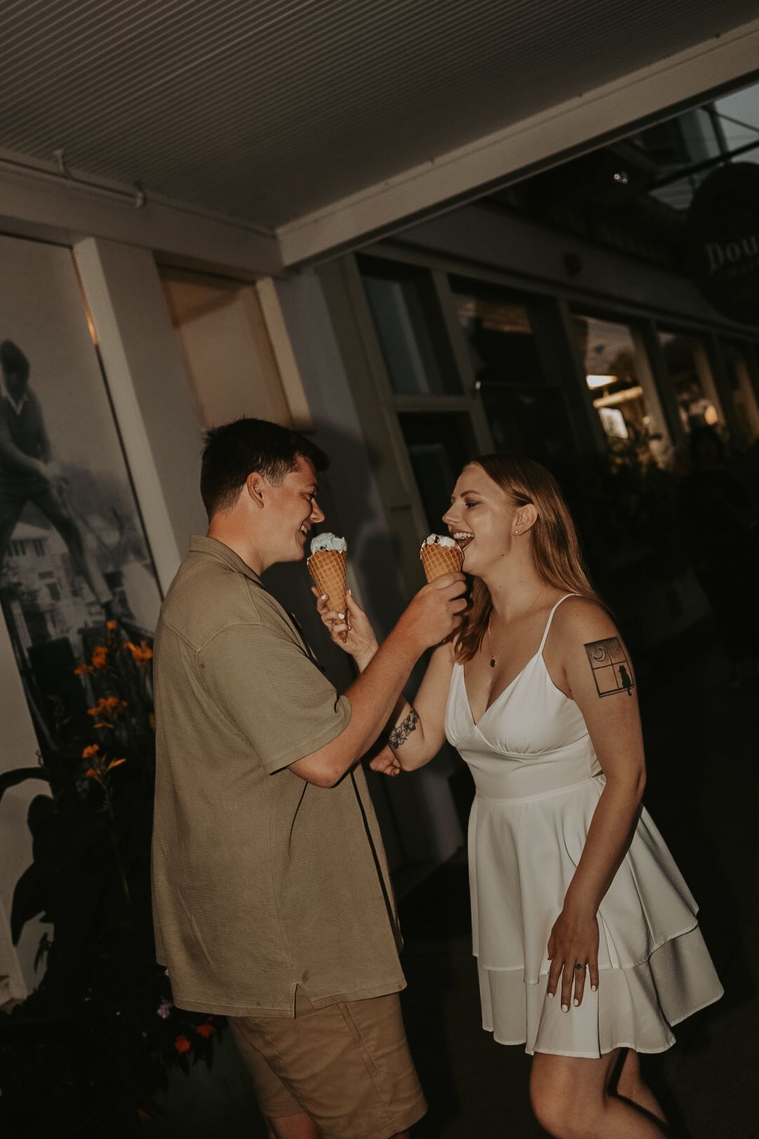 A couple shares an intimate dance moment in a dimly lit indoor venue.