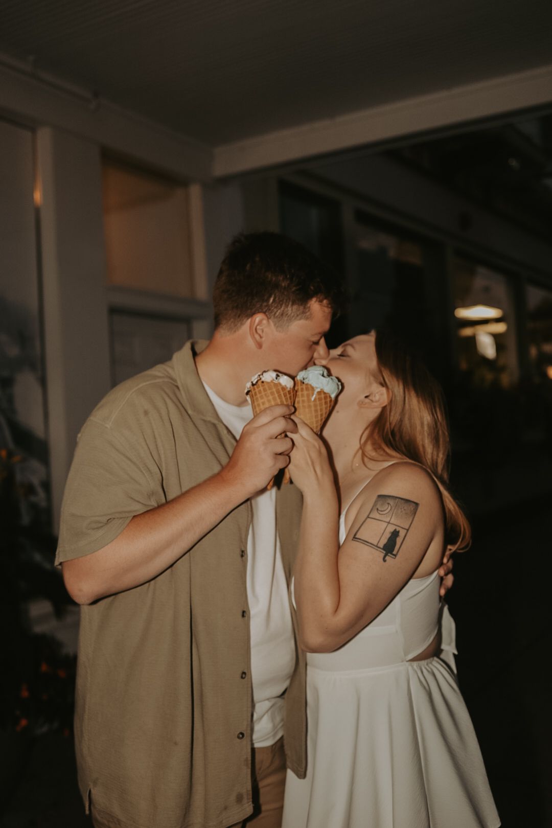 A romantic dance captured in low light at an indoor celebration.