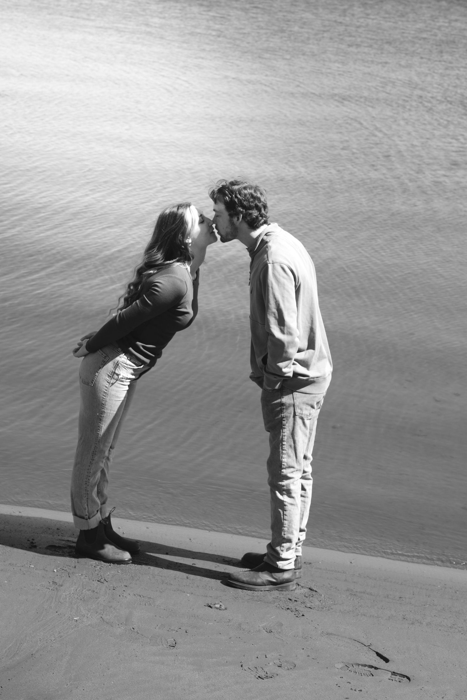 Documentary-style couples photography with genuine interaction. Couple and engagement photo in Sault Ste. Marie.