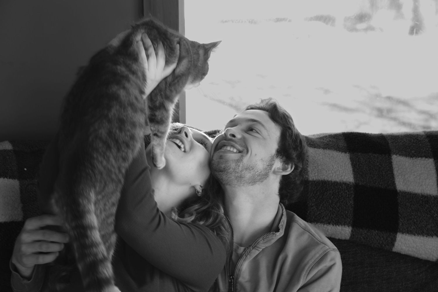 Documentary-style couples photography with genuine interaction. Couple and engagement photo in Sault Ste. Marie.