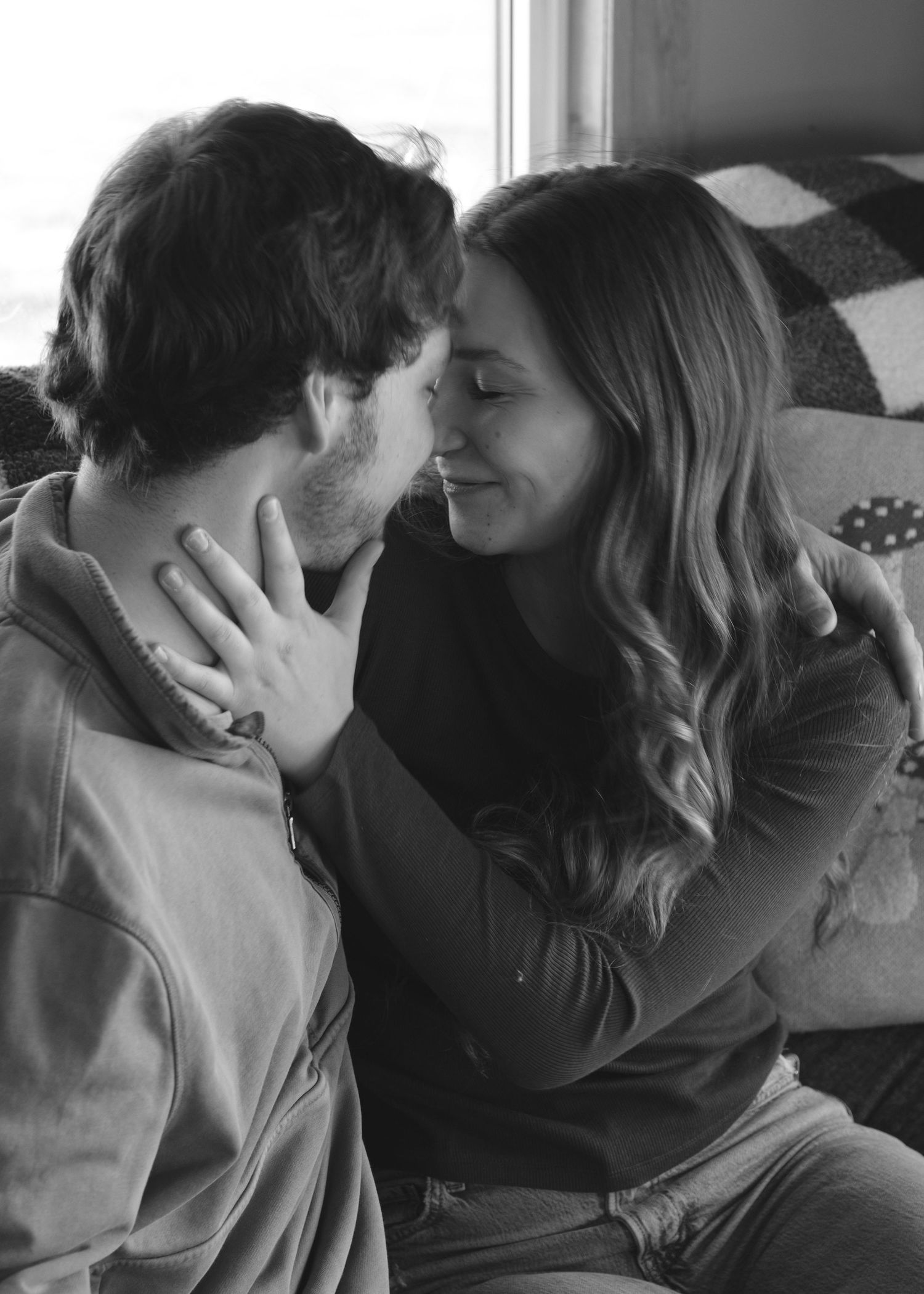 Documentary-style couples photography with genuine interaction. Couple and engagement photo in Sault Ste. Marie.
