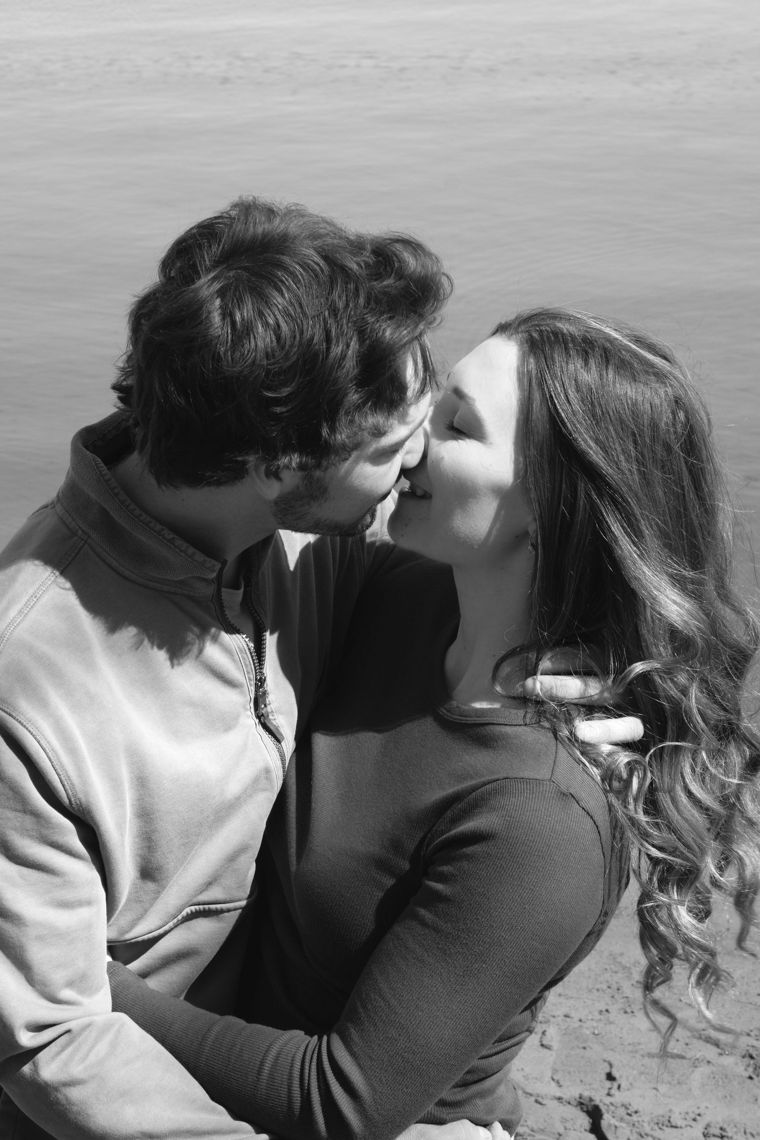 Documentary-style couples photography with genuine interaction. Couple and engagement photo in Sault Ste. Marie.