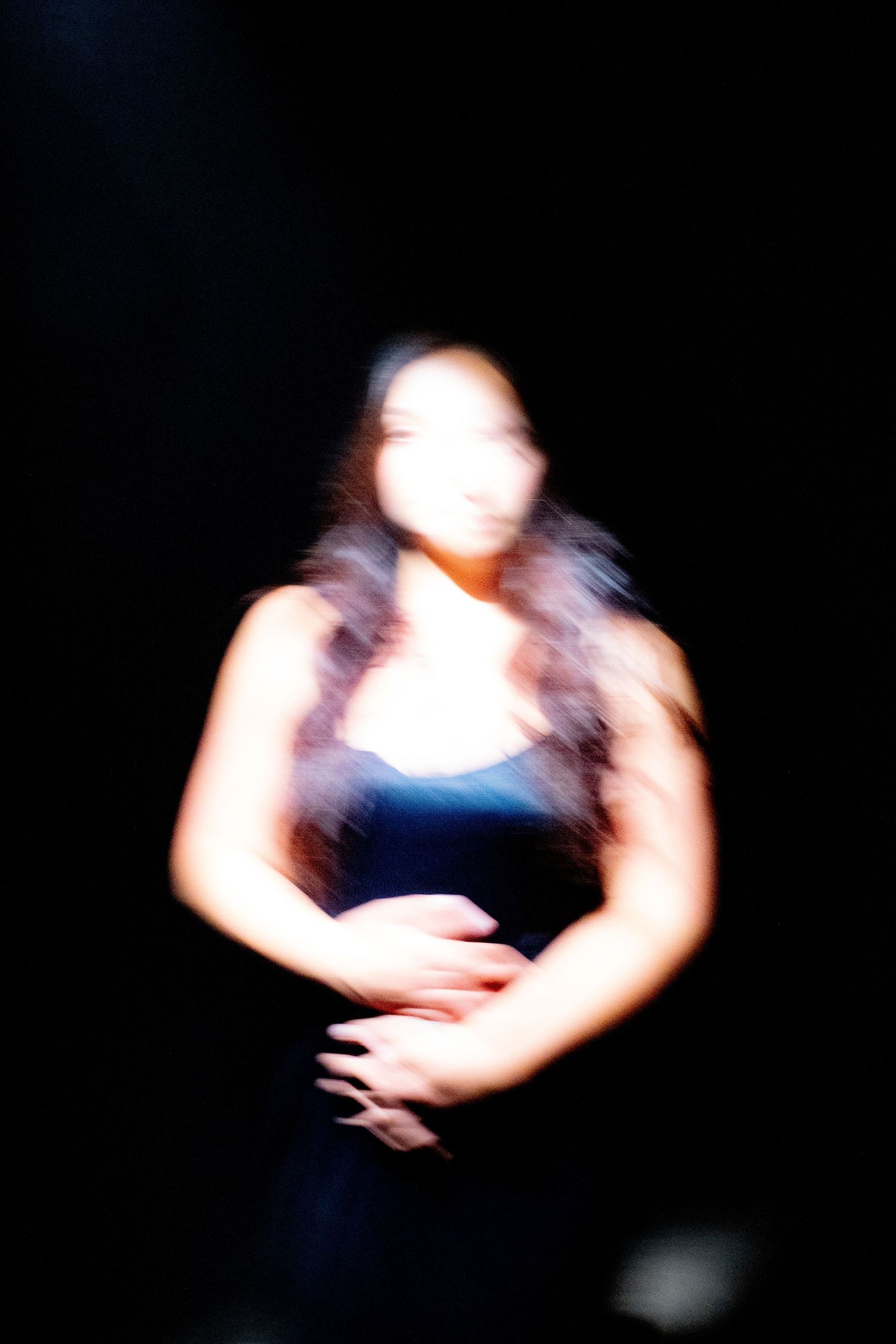 Cinematic music video still featuring an artist performance