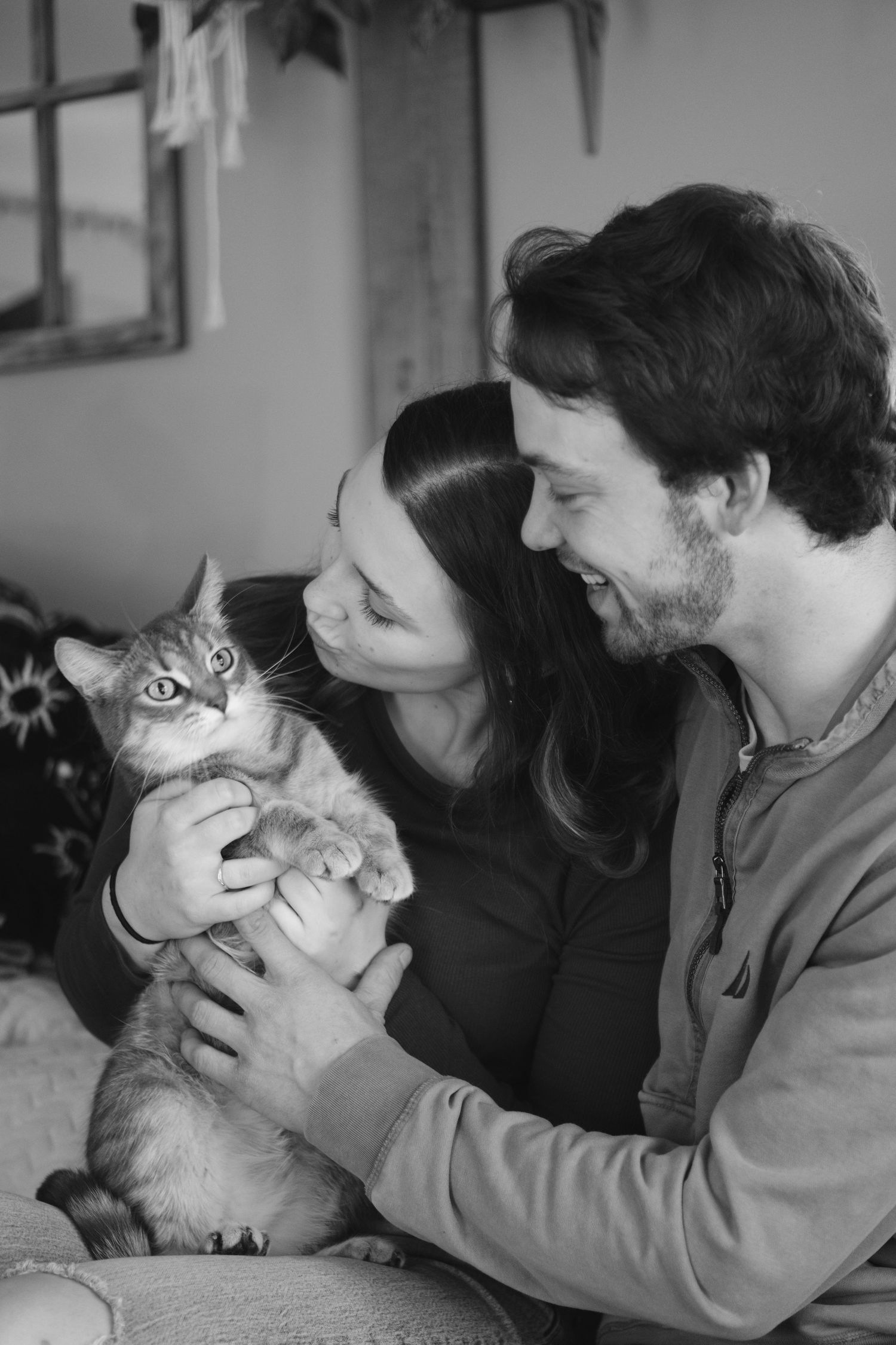 Documentary-style couples photography with genuine interaction. Couple and engagement photo in Sault Ste. Marie.