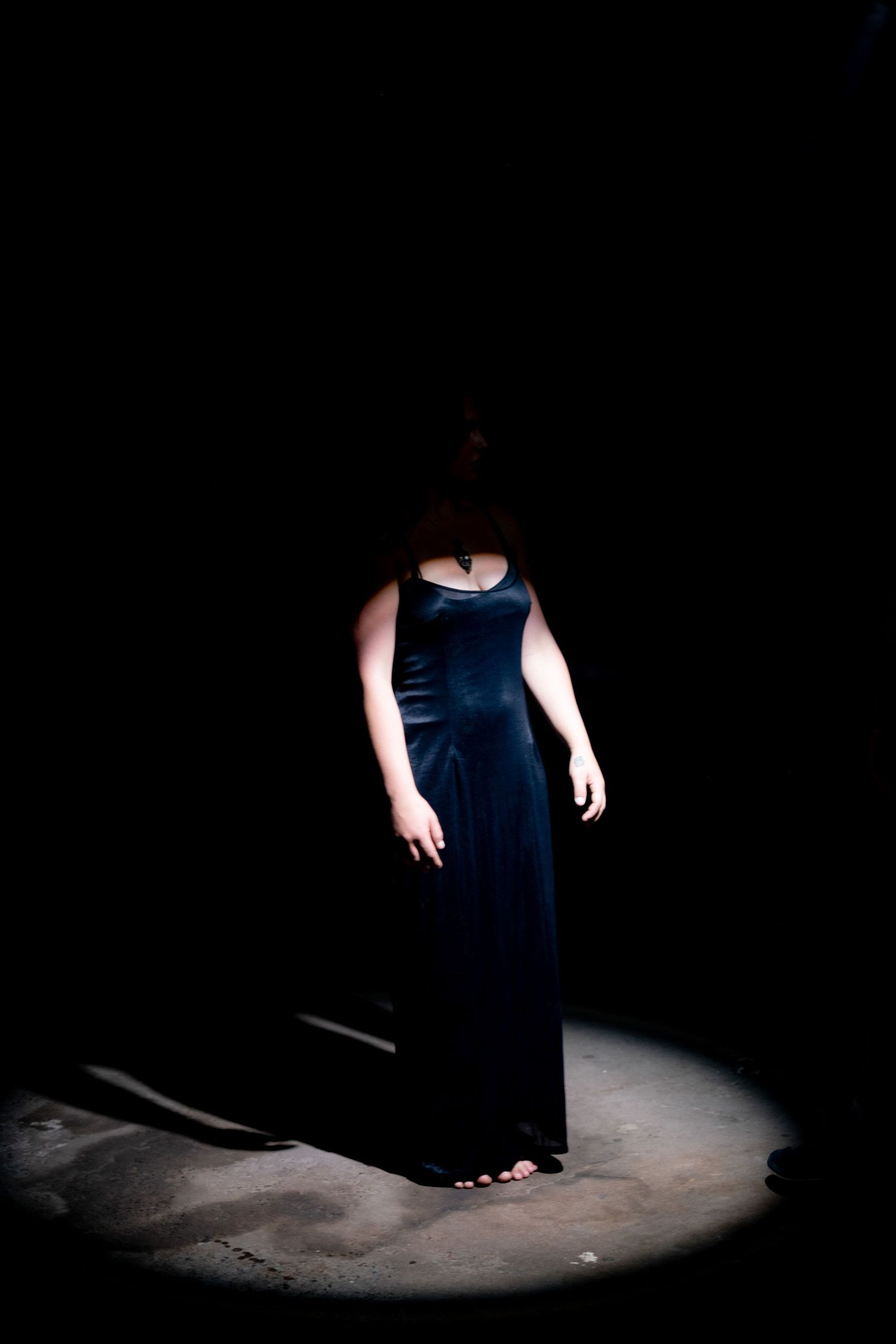 Cinematic music video still featuring an artist performance
