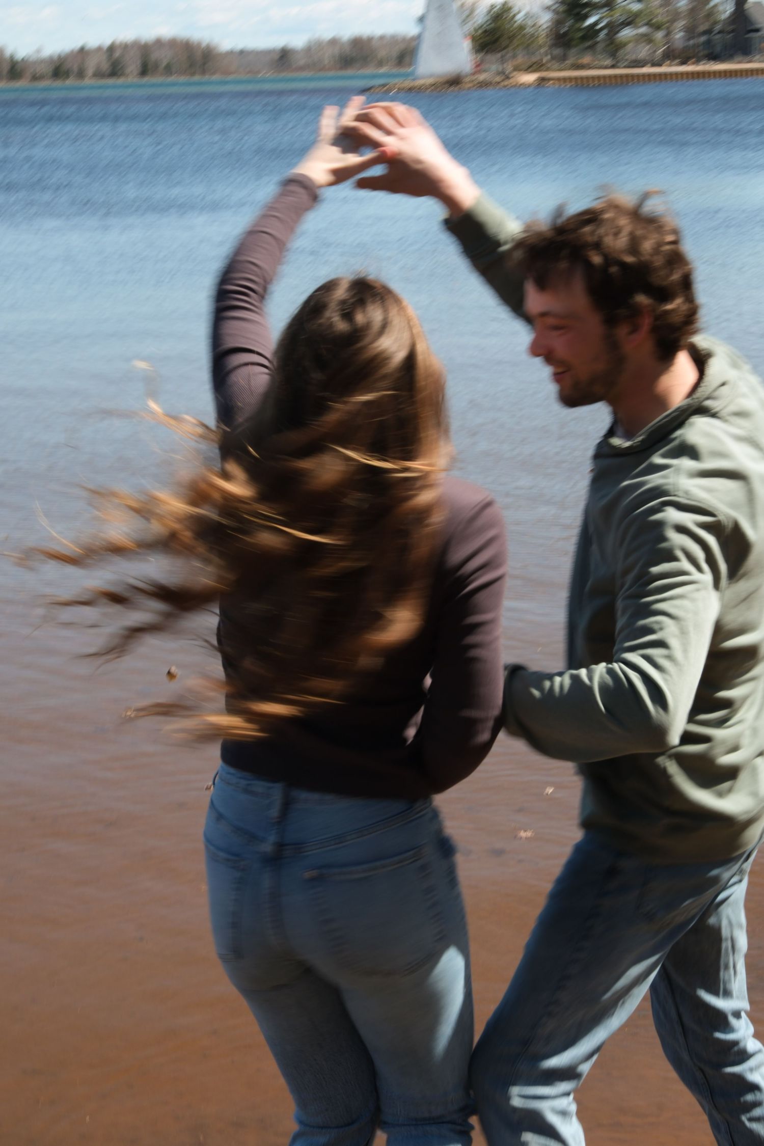 Documentary-style couples photography with genuine interaction. Couple and engagement photo in Sault Ste. Marie.