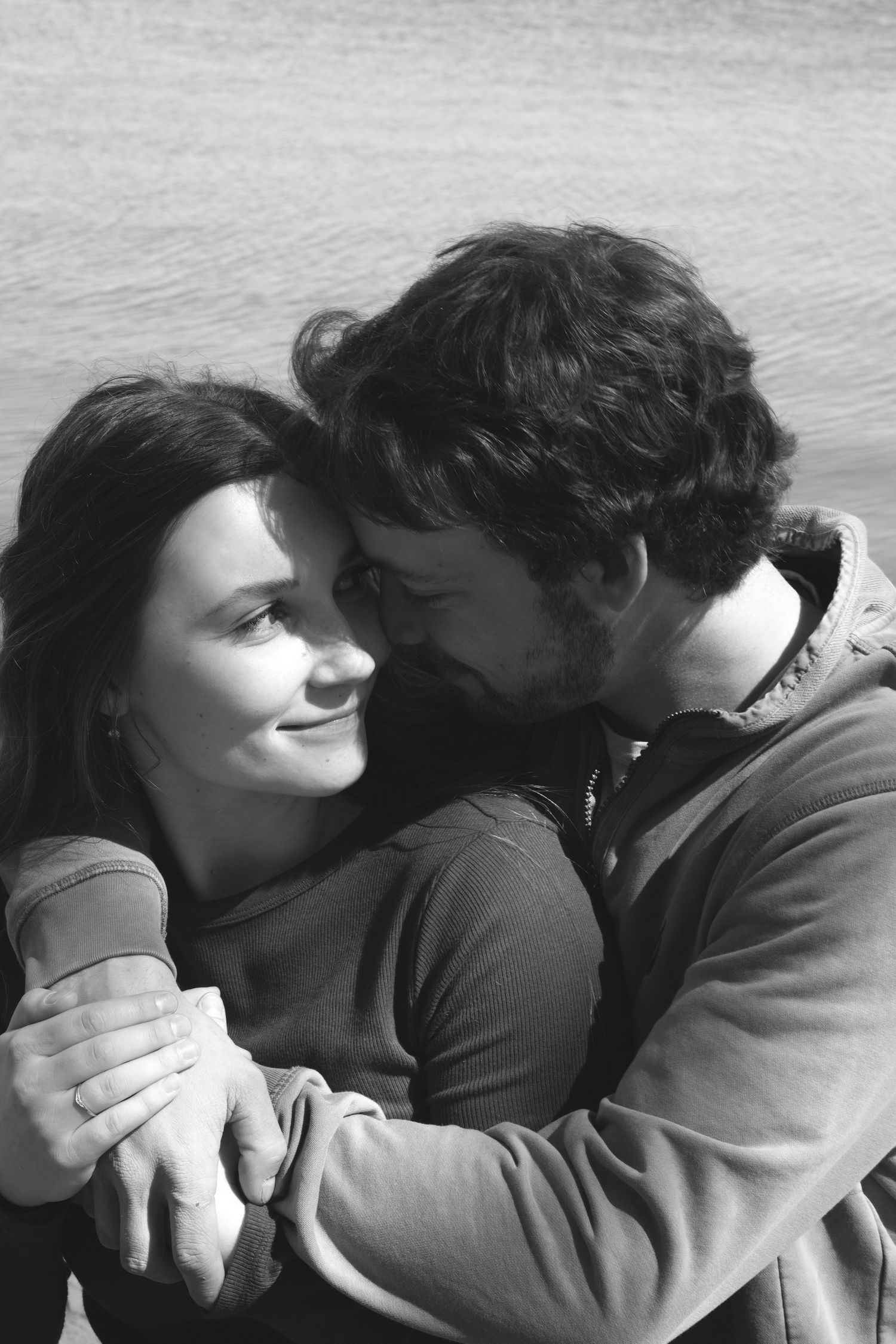 Documentary-style couples photography with genuine interaction. Couple and engagement photo in Sault Ste. Marie.