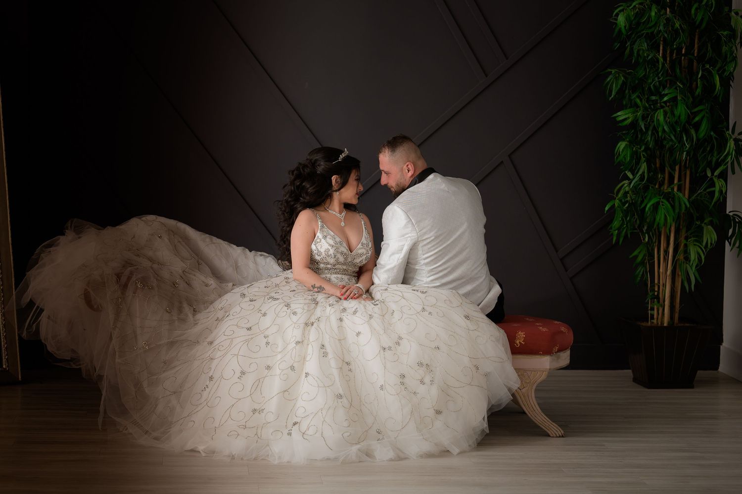 A romantic low-light portrait of newlyweds on their wedding day.