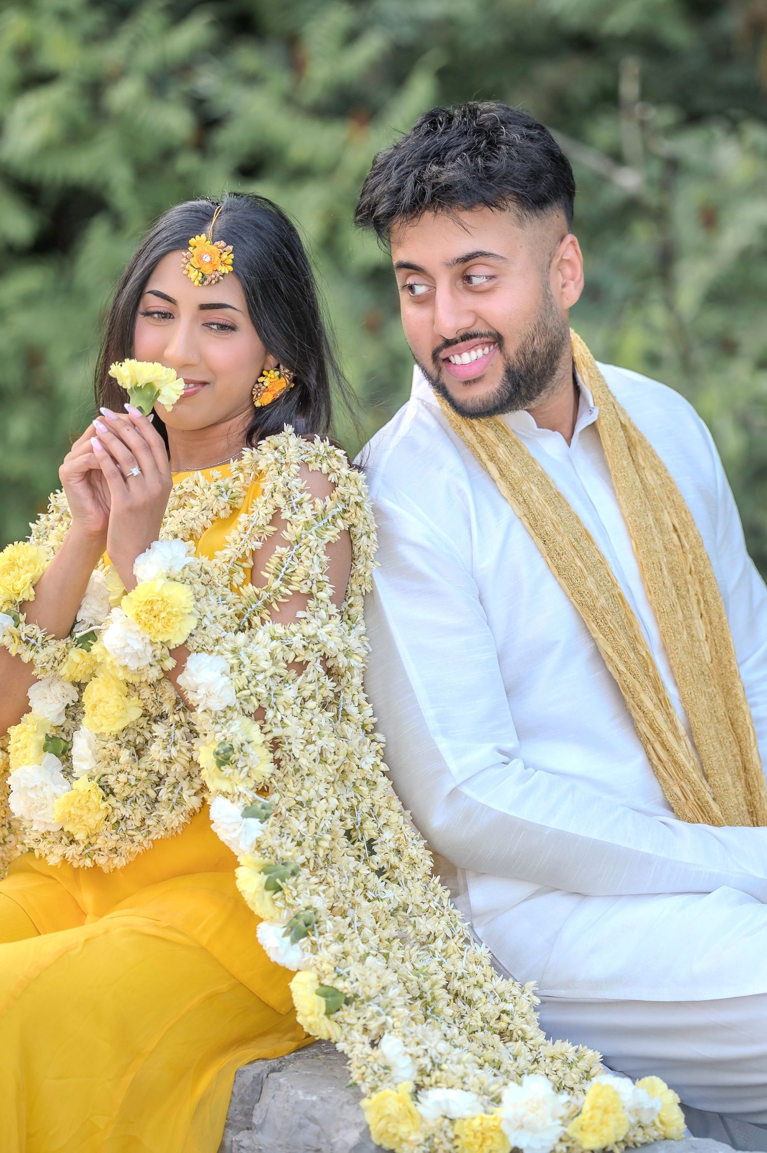 Natural outdoor portrait series with yellow floral dress and traditional white and gold attire.