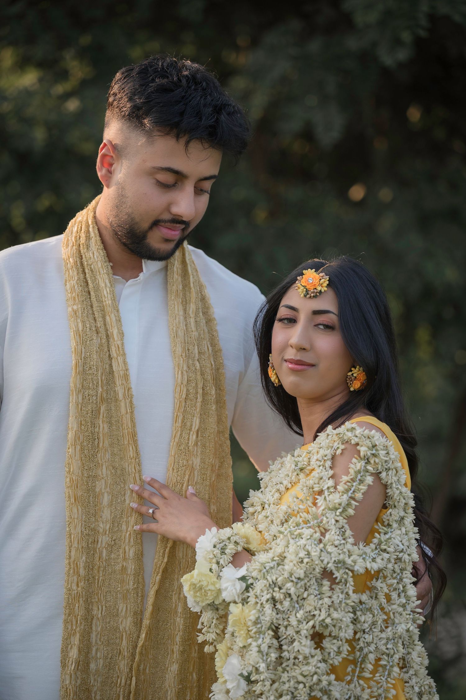 Intimate portrait series featuring traditional attire with gold accents and floral decorations.