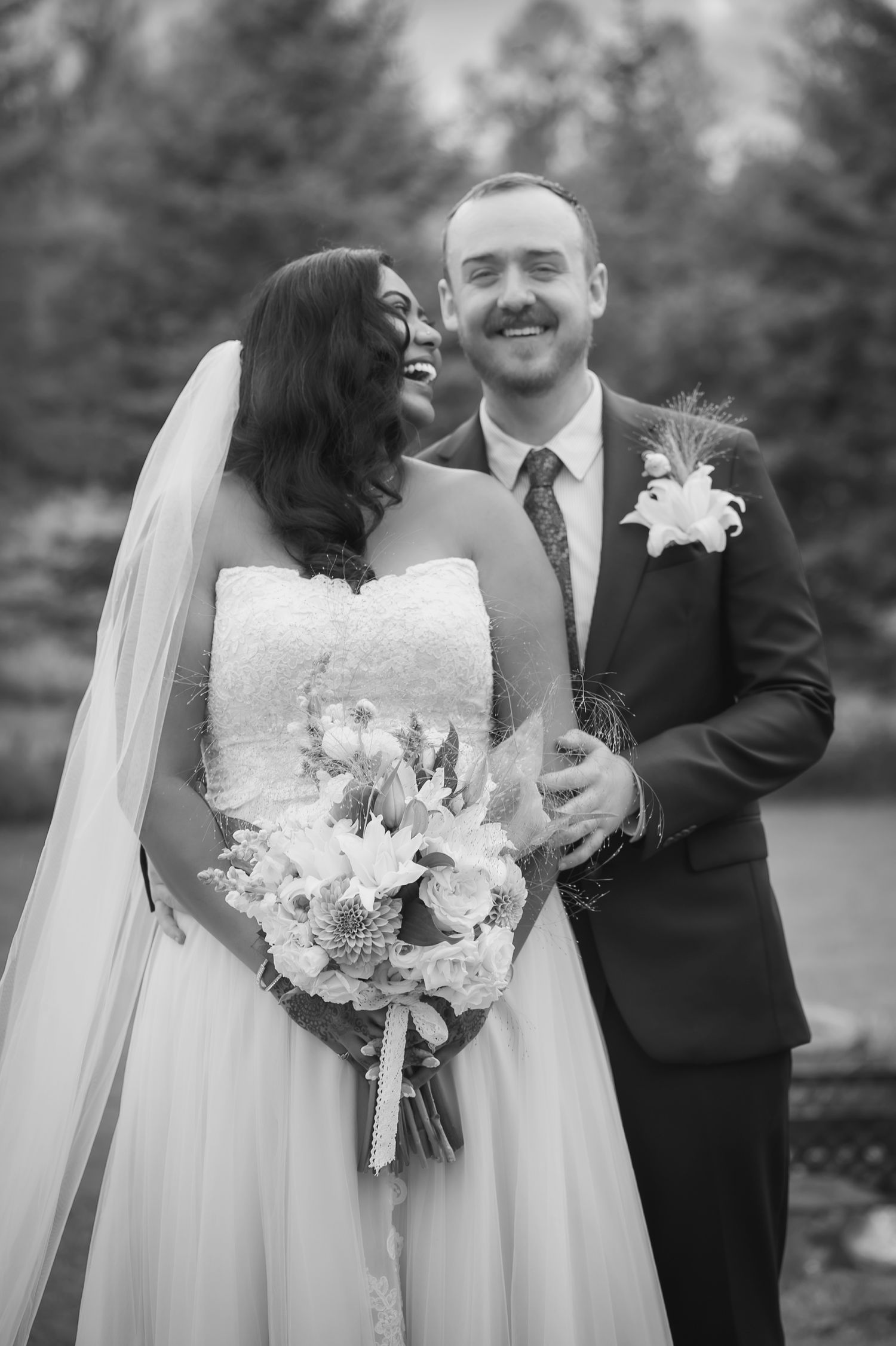 Black and white wedding photos showing happy couple outdoors with bride holding elegant white floral bouquet.