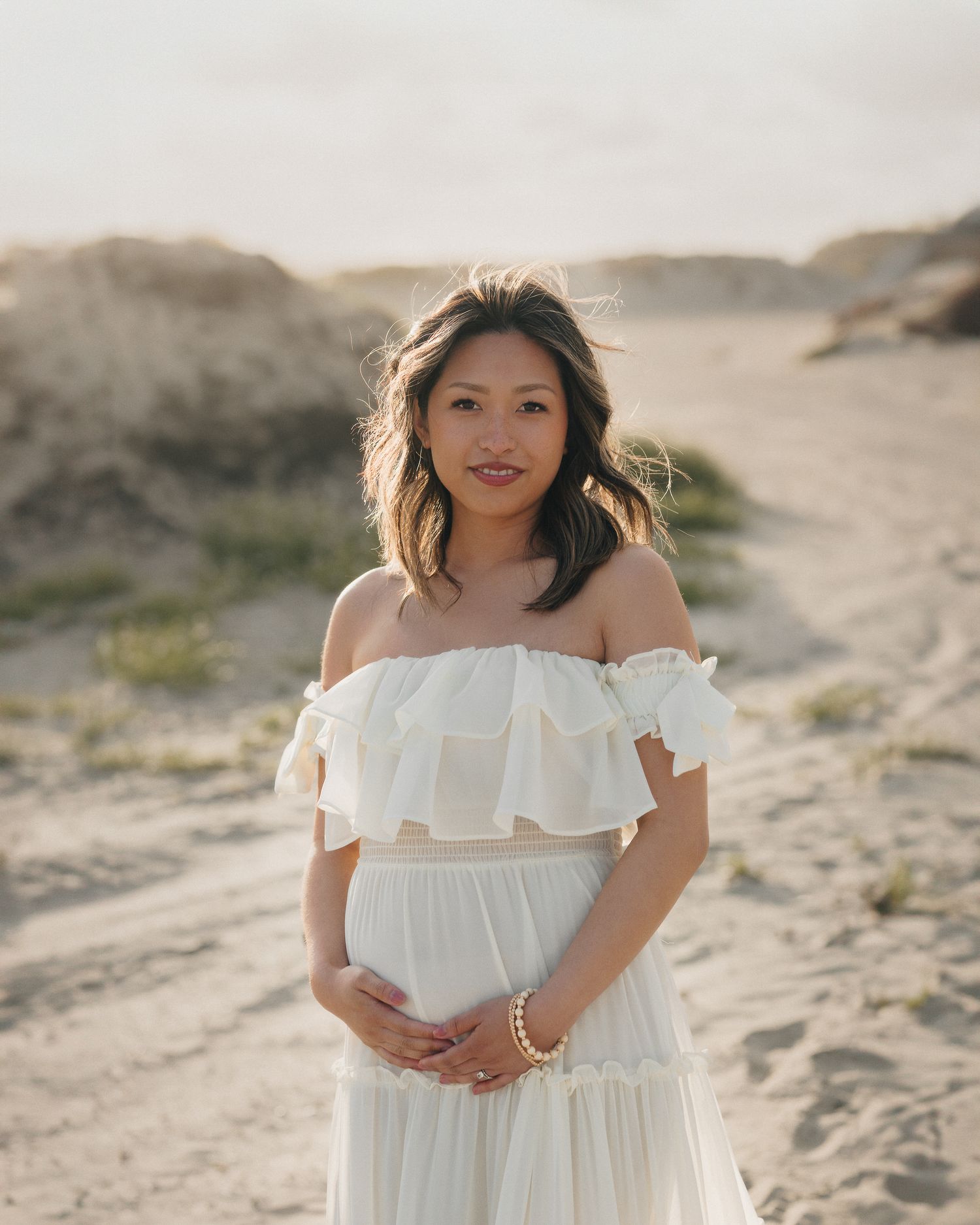 oceanfront maternity portrait during golden hour