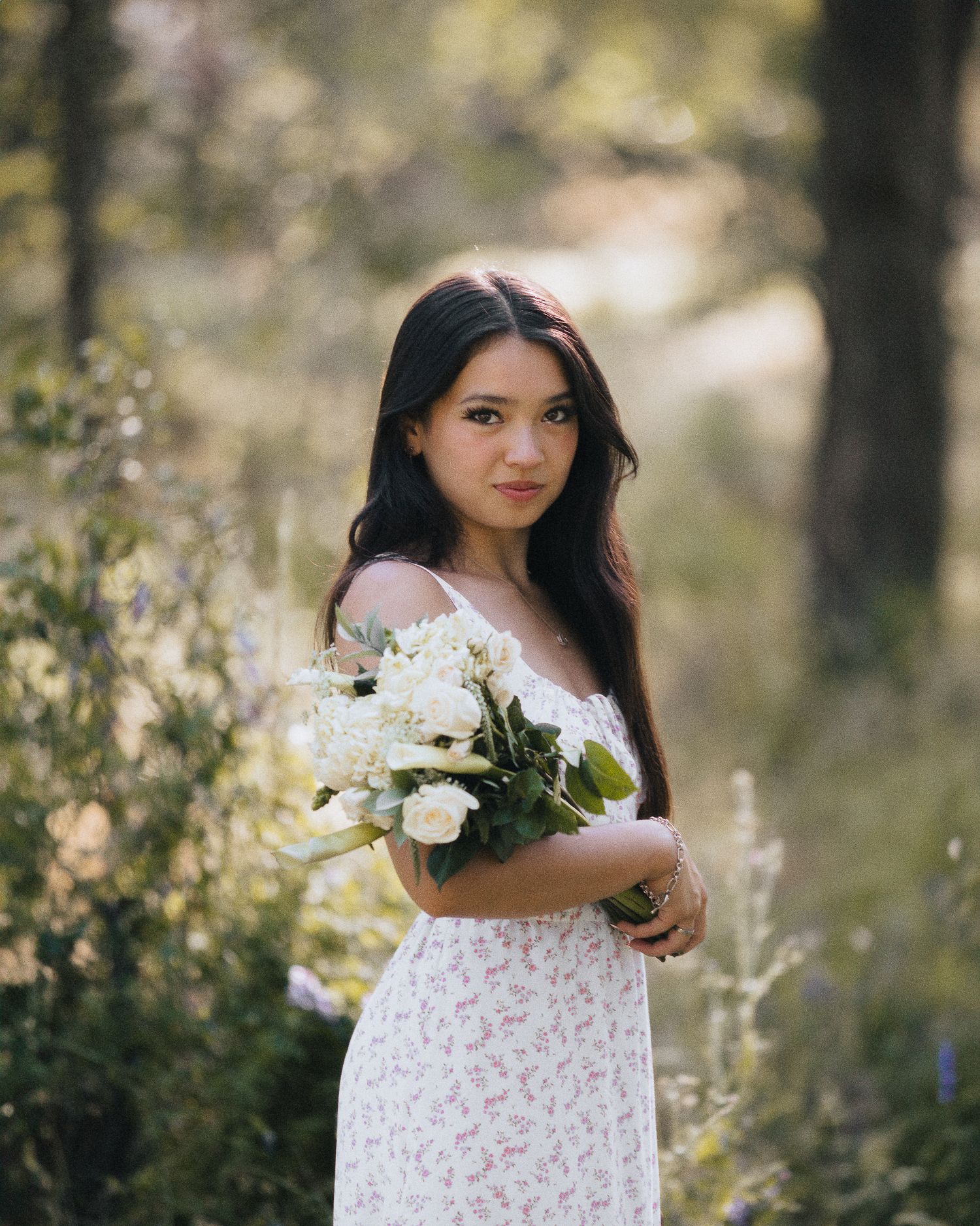 senior posing with flowers in rocklin california