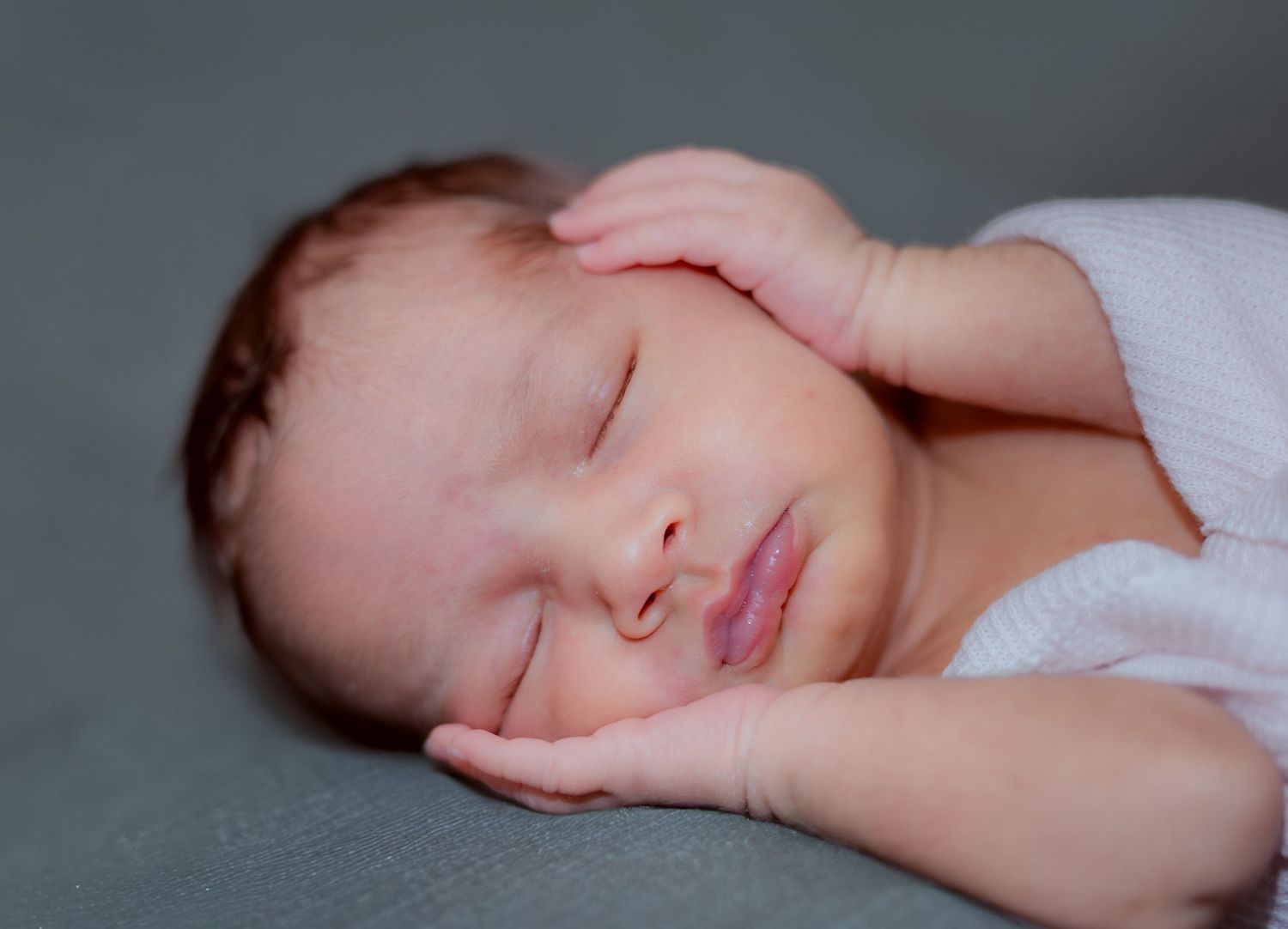 A series of peaceful sleeping baby portraits arranged in a horizontal collage showing different angles and poses.