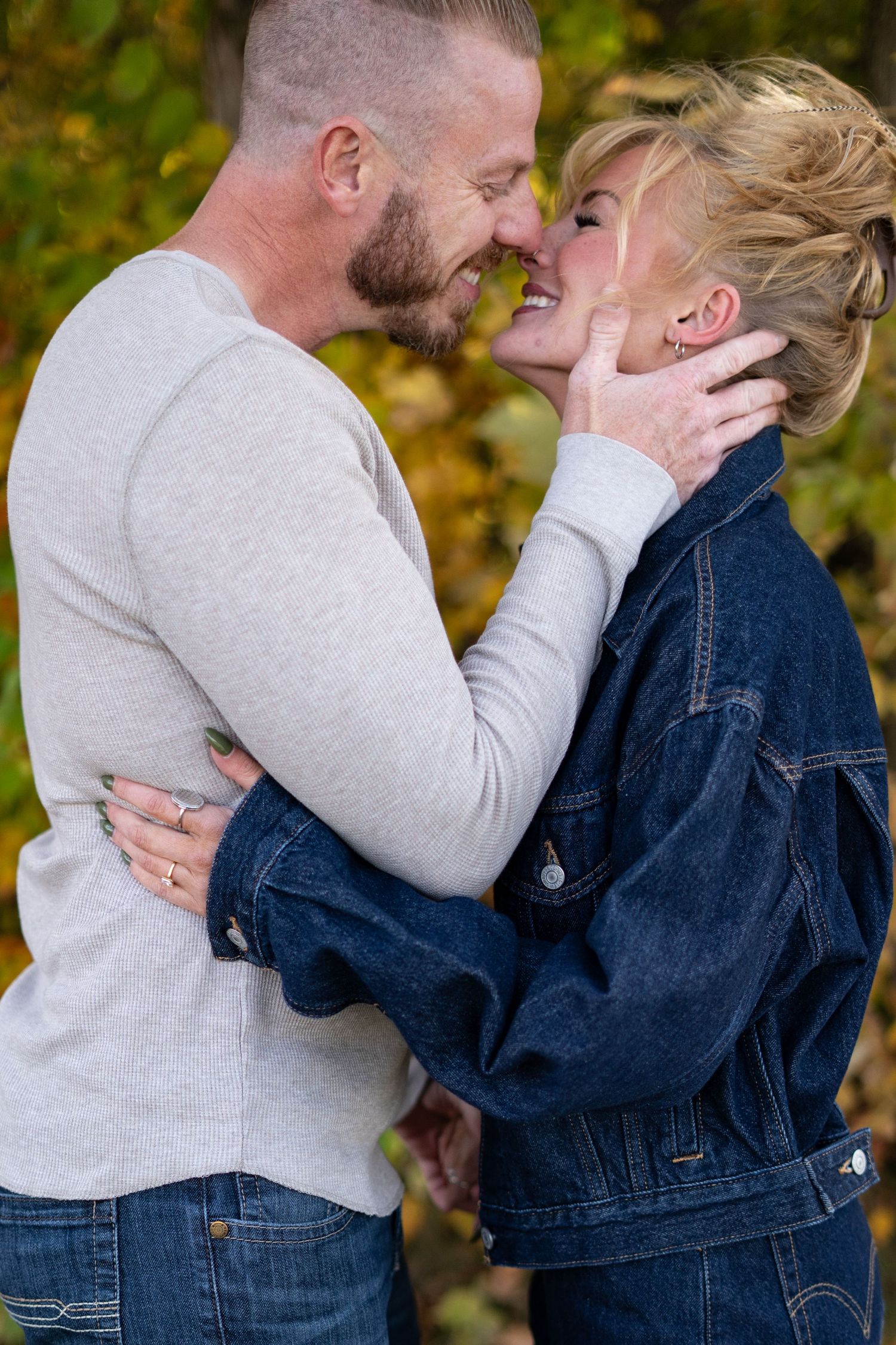 A romantic sequence of photos showing a couple in denim and grey embracing outdoors during autumn.