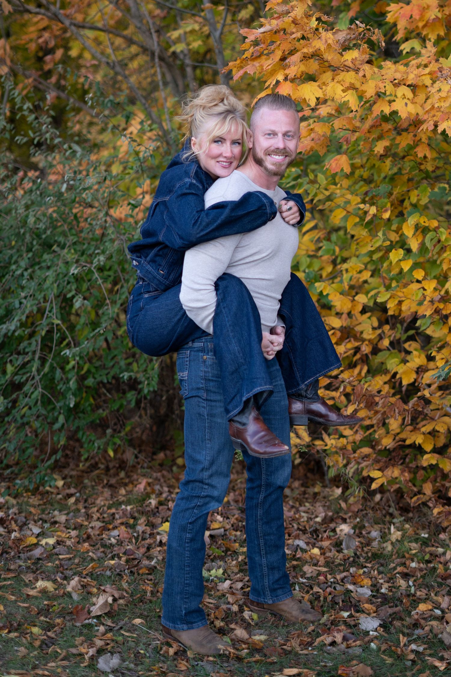 Playful couple poses captured in sequence against colorful autumn foliage.