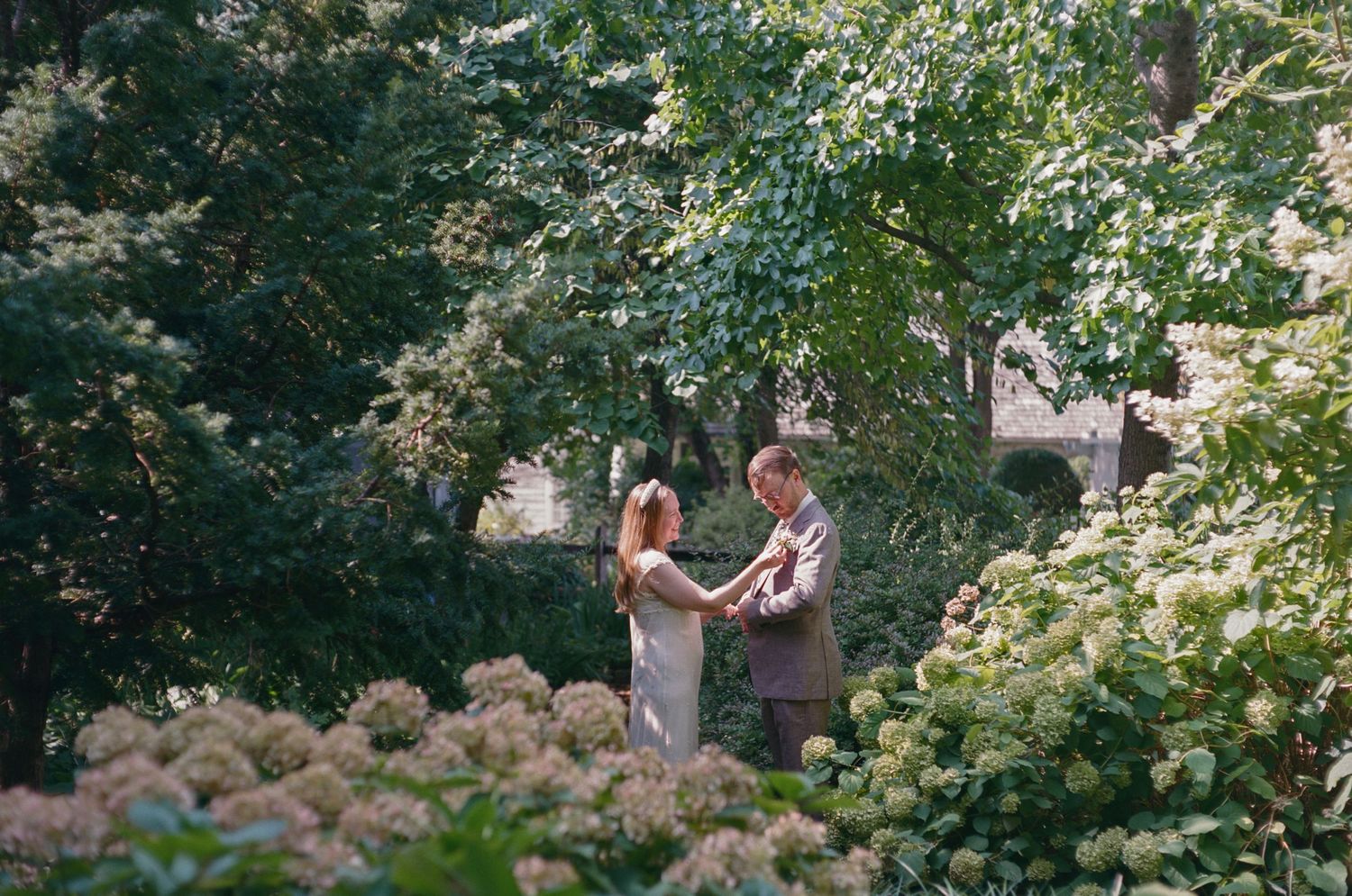 wedding photo of couple in lush garden at vander ende onderdonk house in ridgewood new york