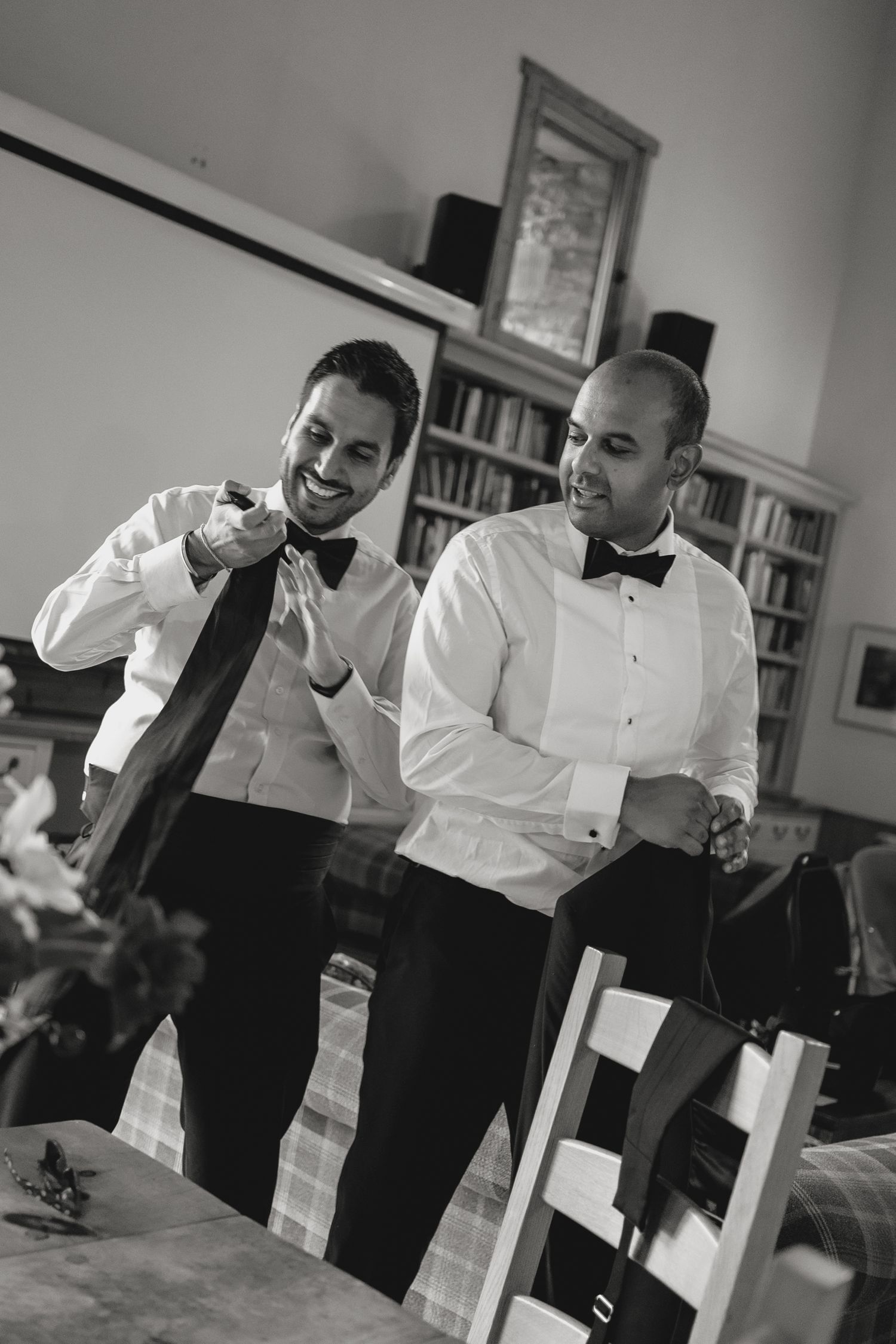 Professional waitstaff preparing for service in formal attire.