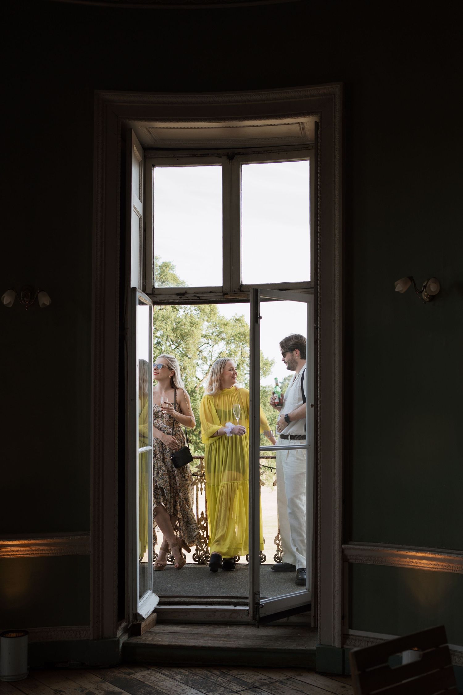 Series showing people gathering by a window in varying natural light conditions.