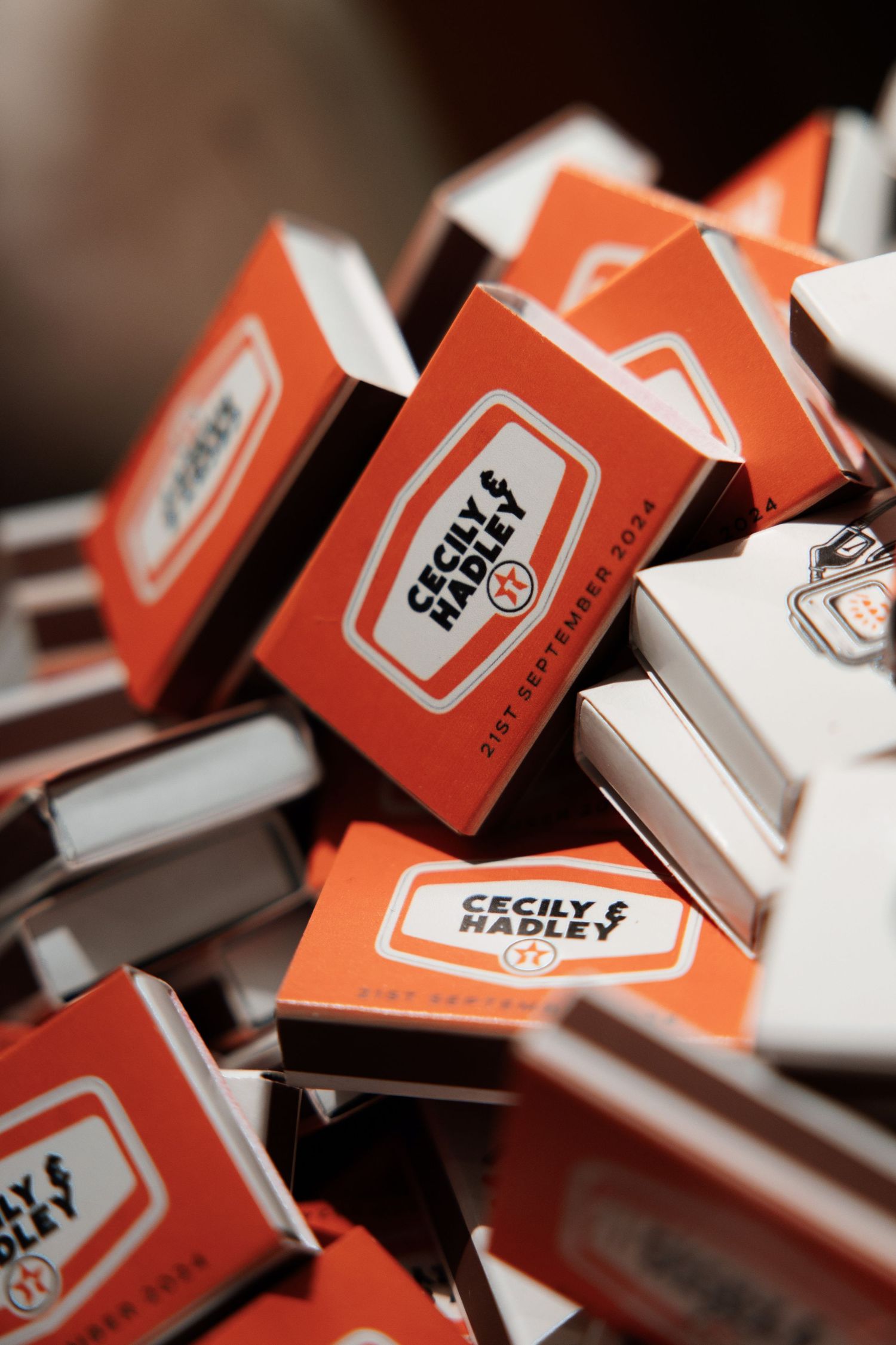 Orange and white name cards or place settings arranged in a row.