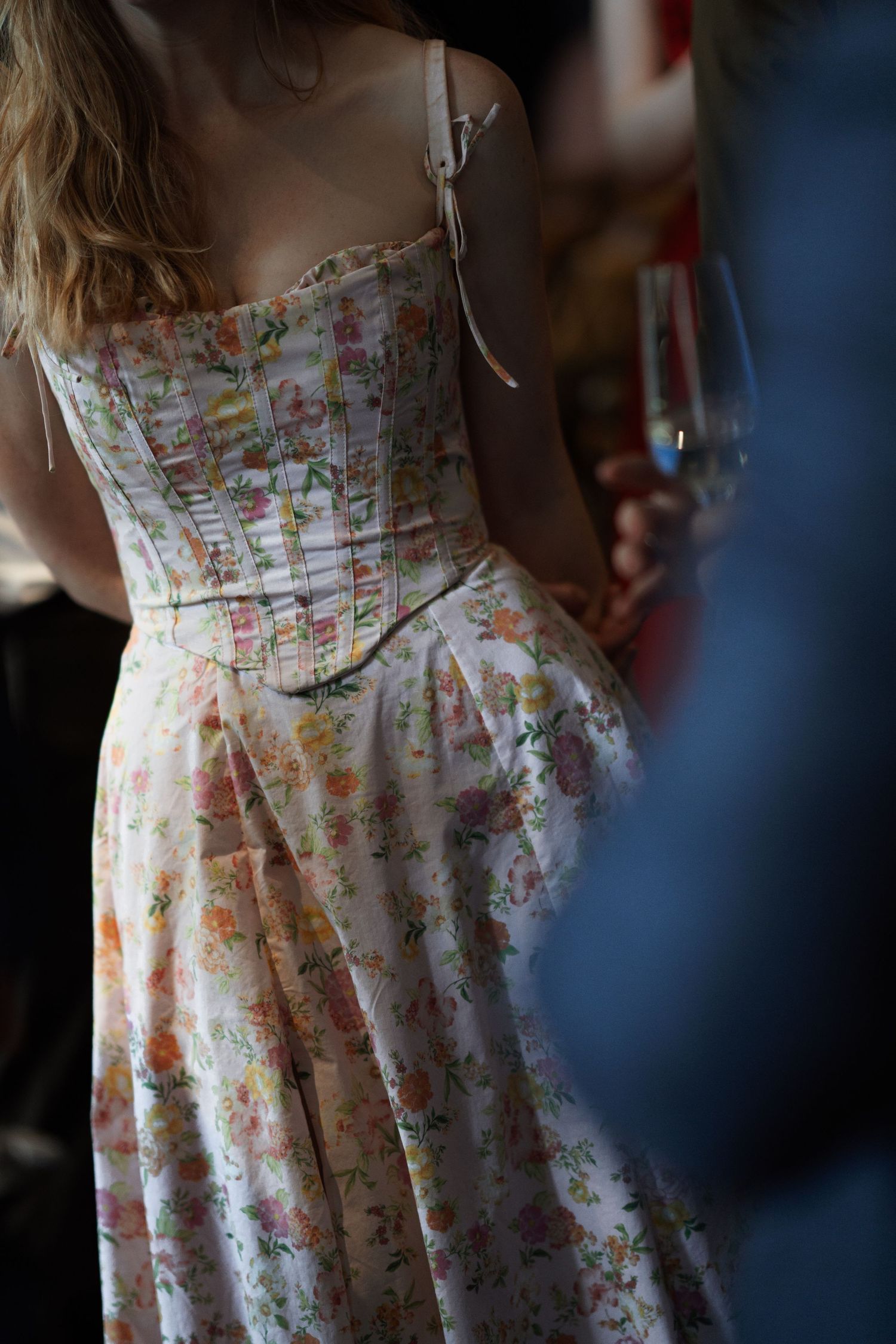 Close-up of floral print summer dress in soft lighting.