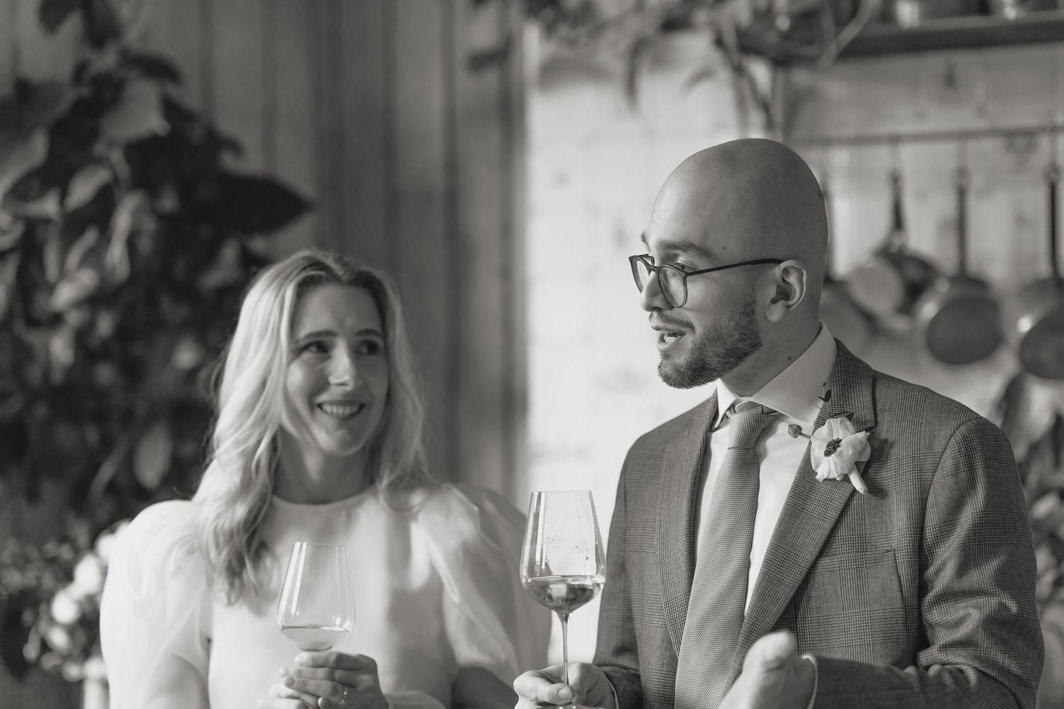 Candid black and white shots of guests laughing and socializing at event.