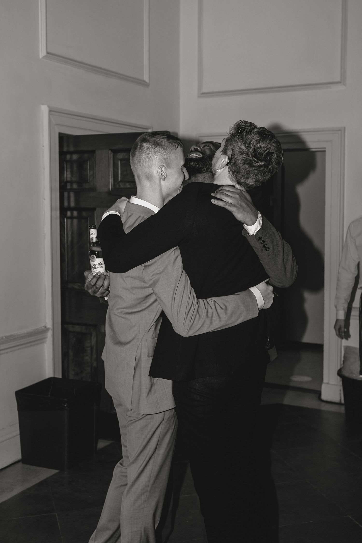 Black and white photo sequence showing couples dancing together in an empty room.
