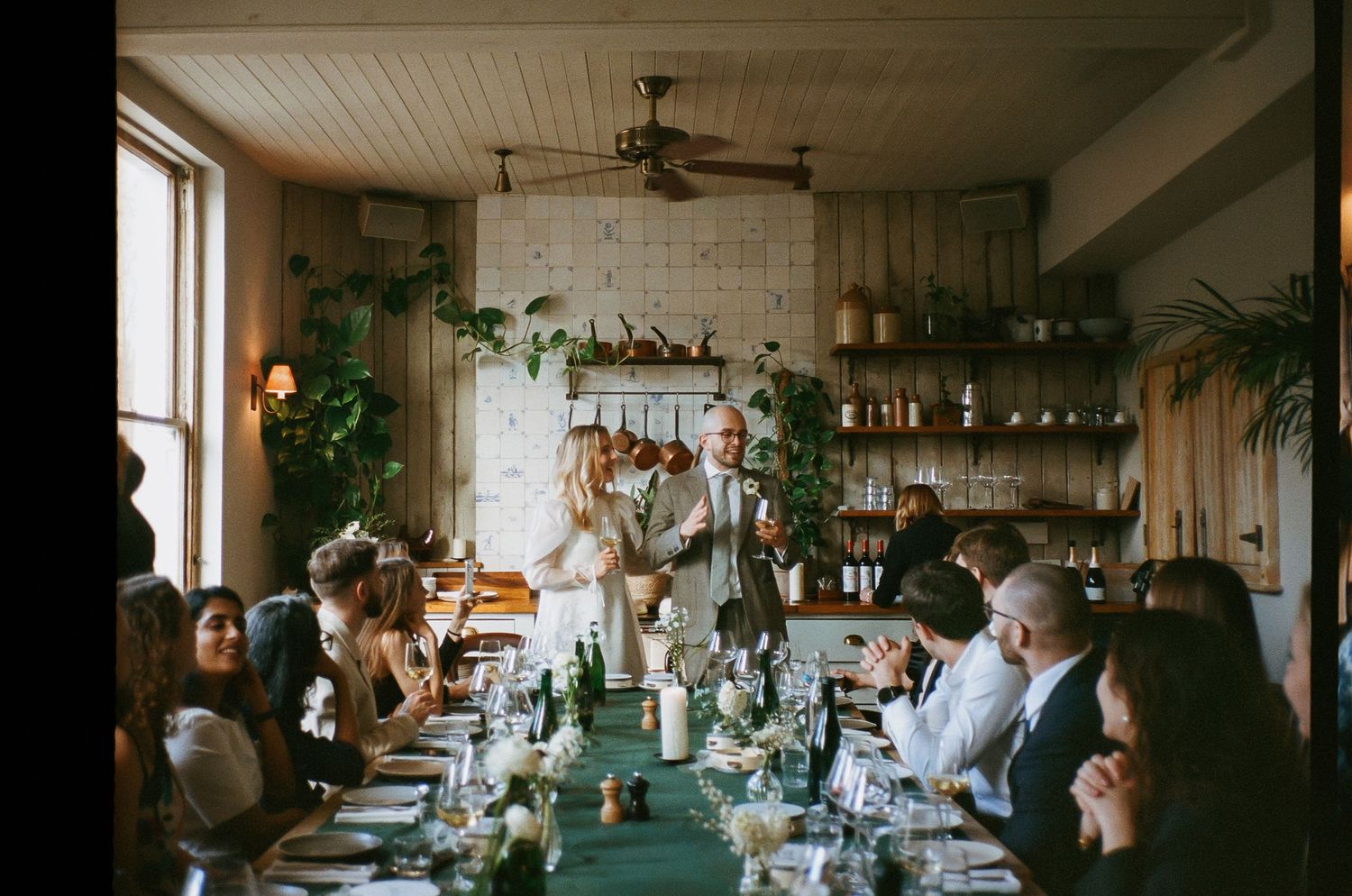 Intimate wedding reception venue with warm lighting and rustic decor.
